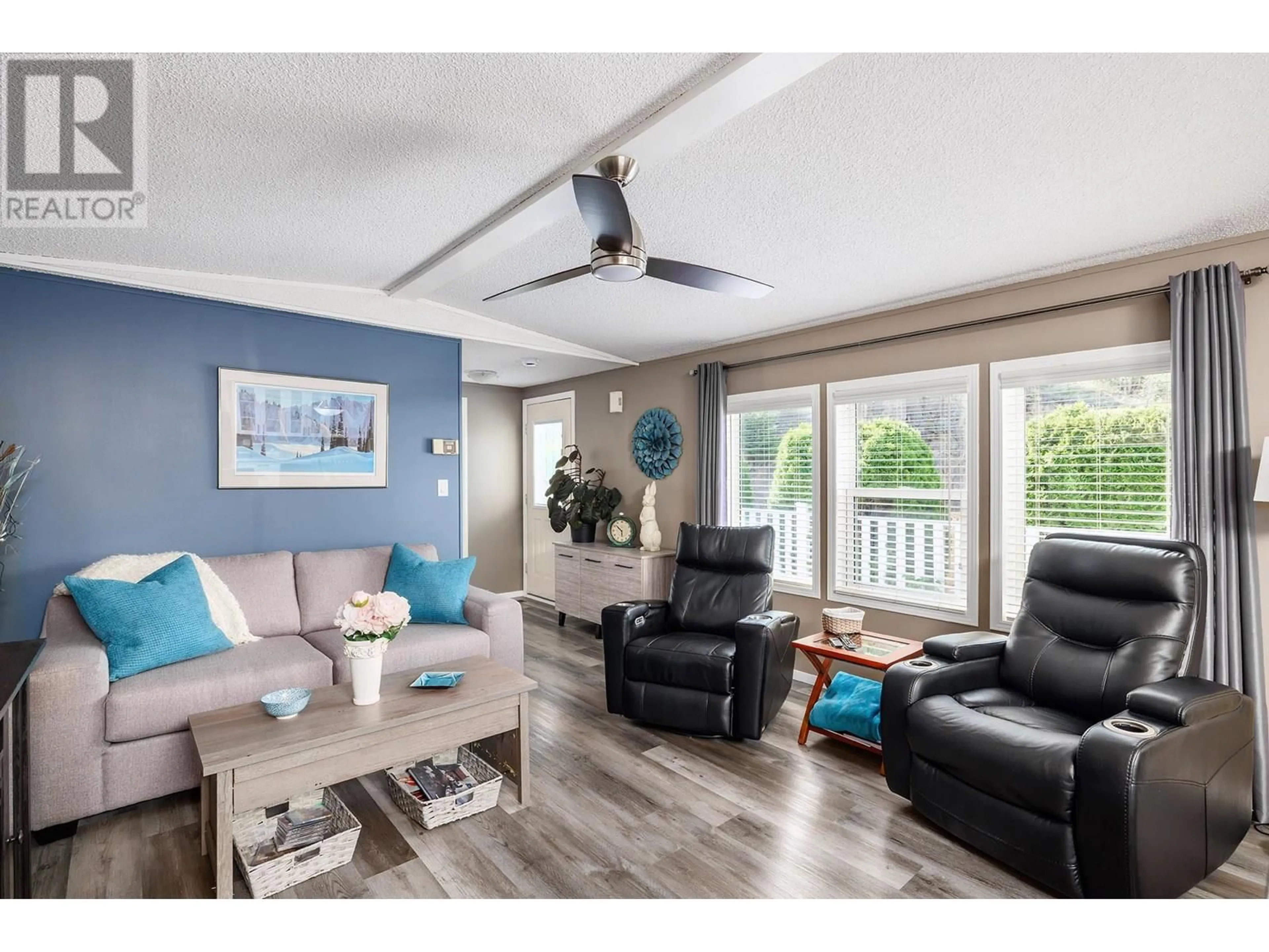 Living room with furniture, wood/laminate floor for 29 - 1750 LENZ ROAD, West Kelowna British Columbia V1Z3N1