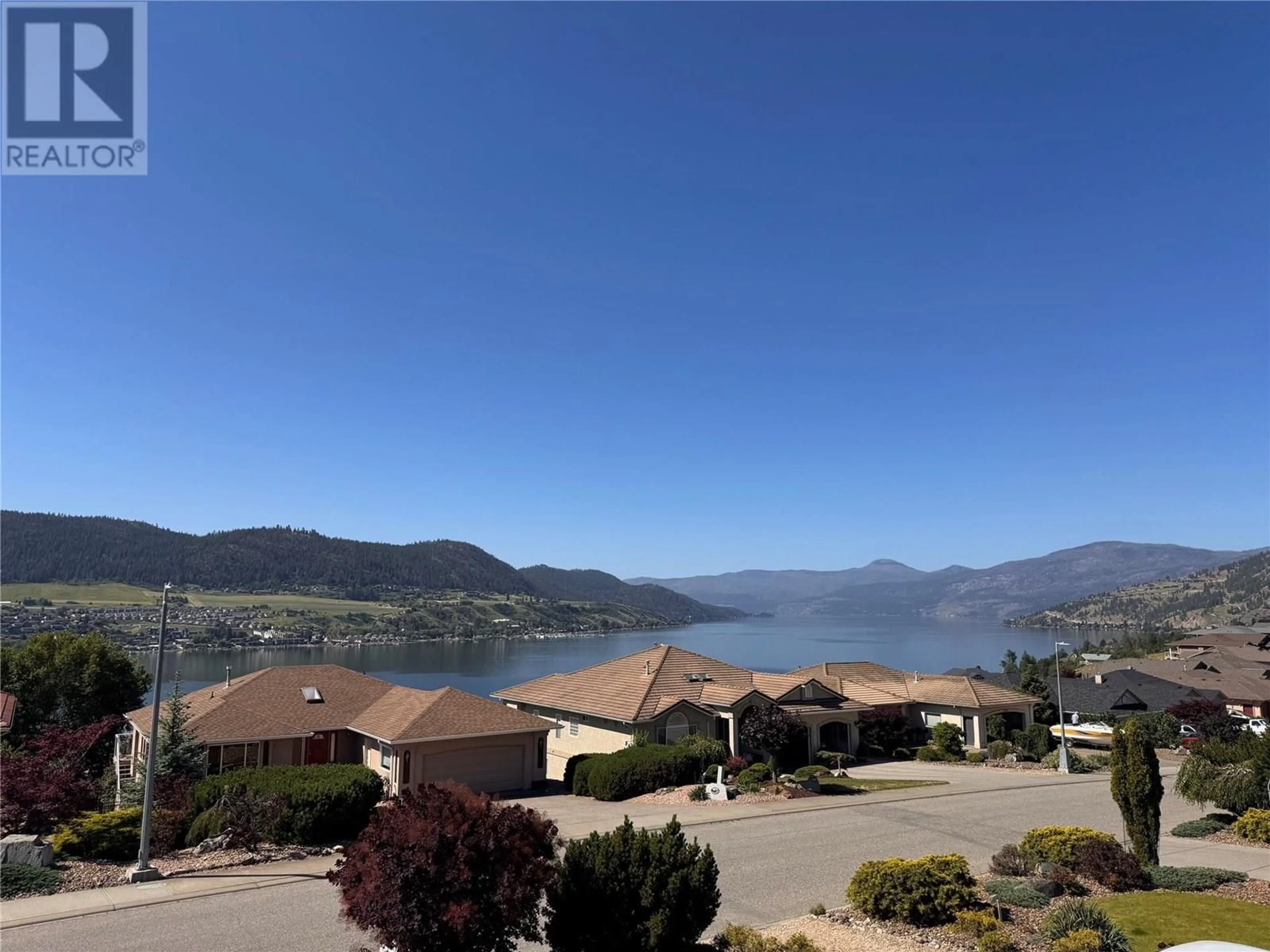 A pic from outside/outdoor area/front of a property/back of a property/a pic from drone, water/lake/river/ocean view for 7074 LAKERIDGE DRIVE, Vernon British Columbia V1H1P3