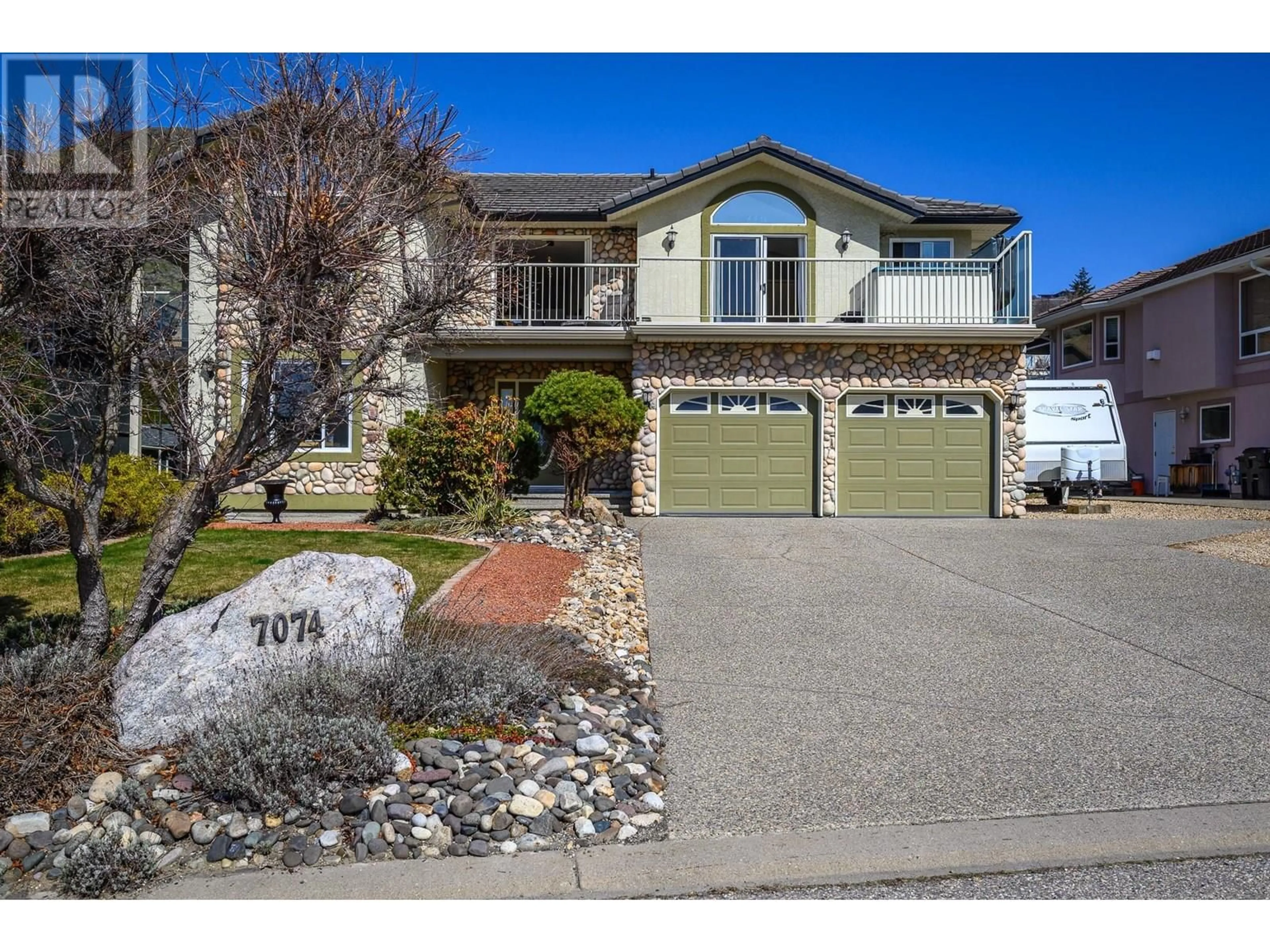 Home with vinyl exterior material, street for 7074 LAKERIDGE DRIVE, Vernon British Columbia V1H1P3