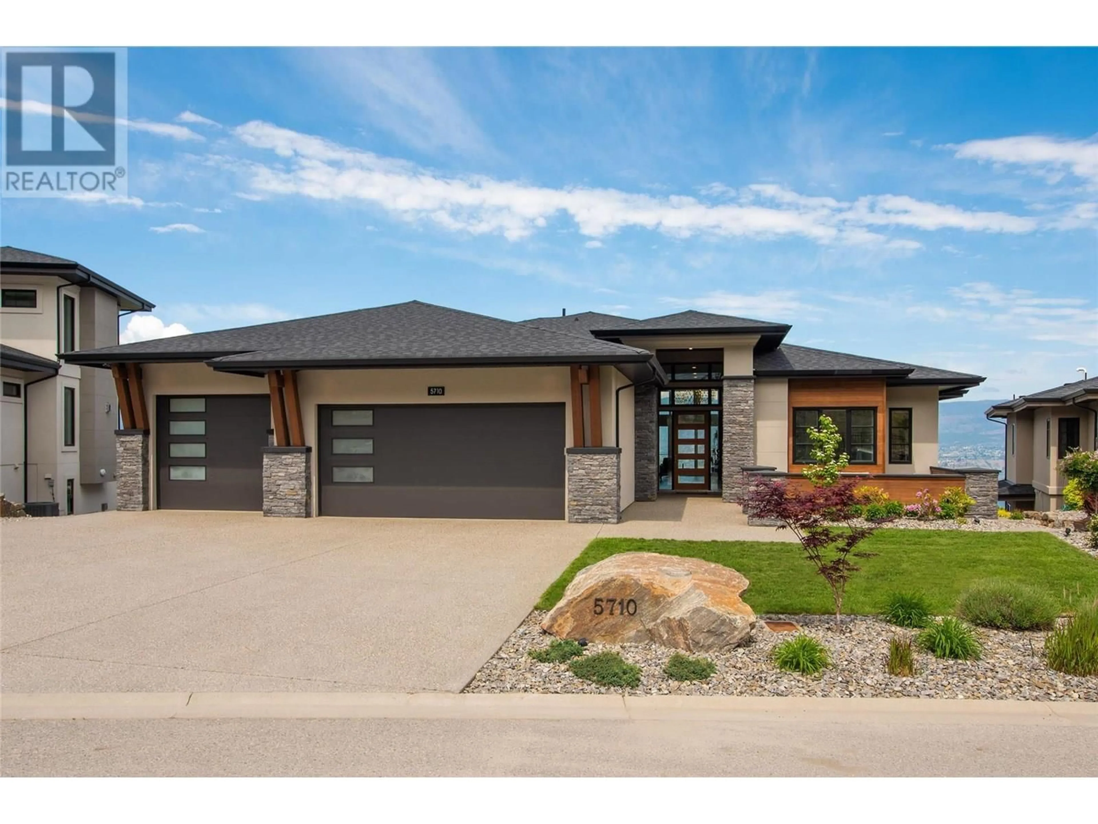 Home with brick exterior material, street for 5710 JASPER WAY, Kelowna British Columbia V1W5L7