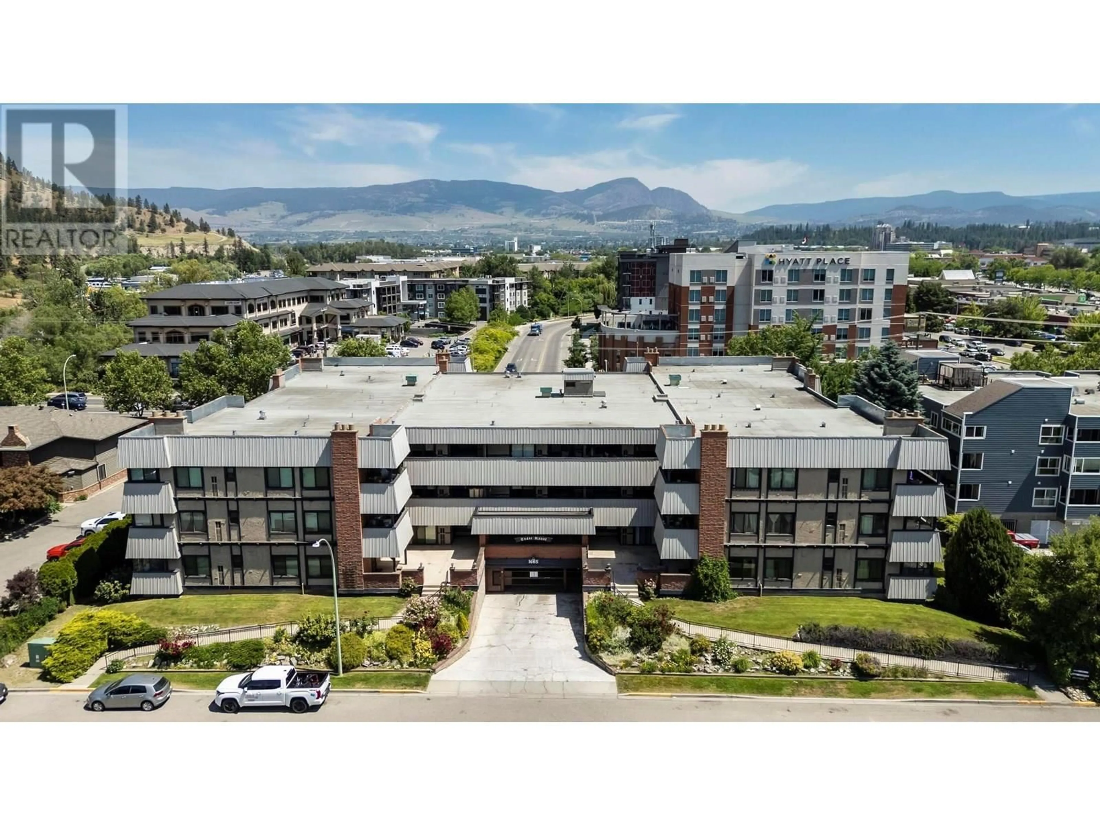A pic from outside/outdoor area/front of a property/back of a property/a pic from drone, mountain view for 104 - 1665 UFTON COURT, Kelowna British Columbia V1Y8G7