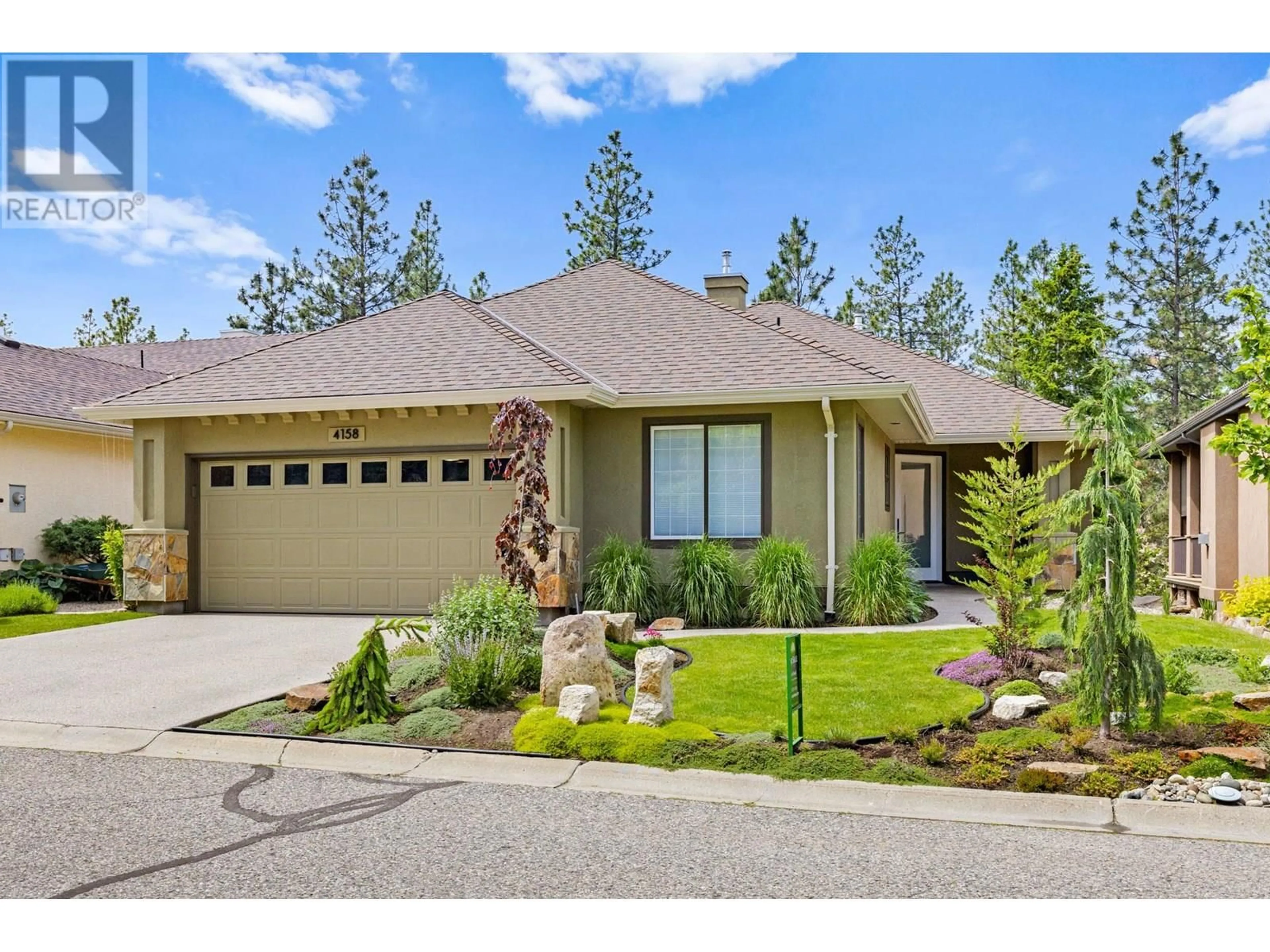 Home with vinyl exterior material, street for 4158 GALLAGHERS FOREST SOUTH, Kelowna British Columbia V1W5E4