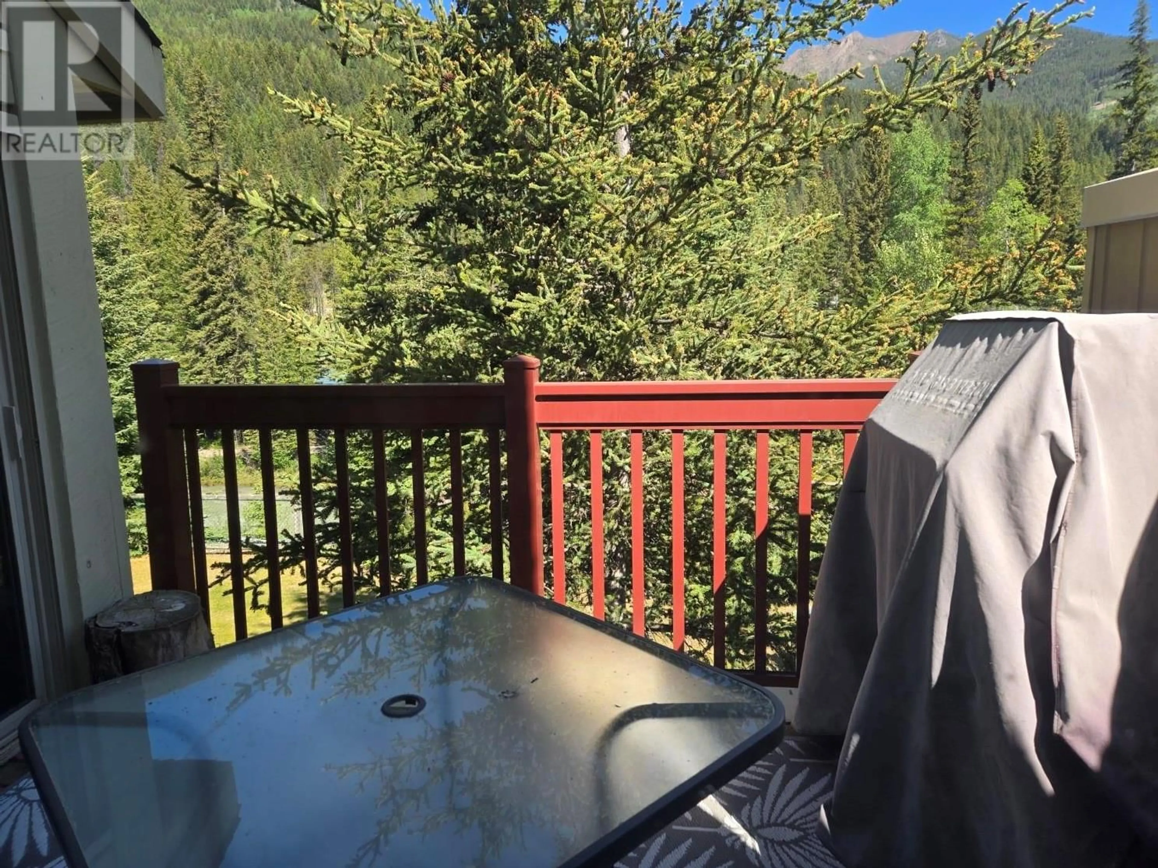 Balcony in the apartment, forest/trees view for 2035 PANORAMA DRIVE, Panorama British Columbia V0A1T0