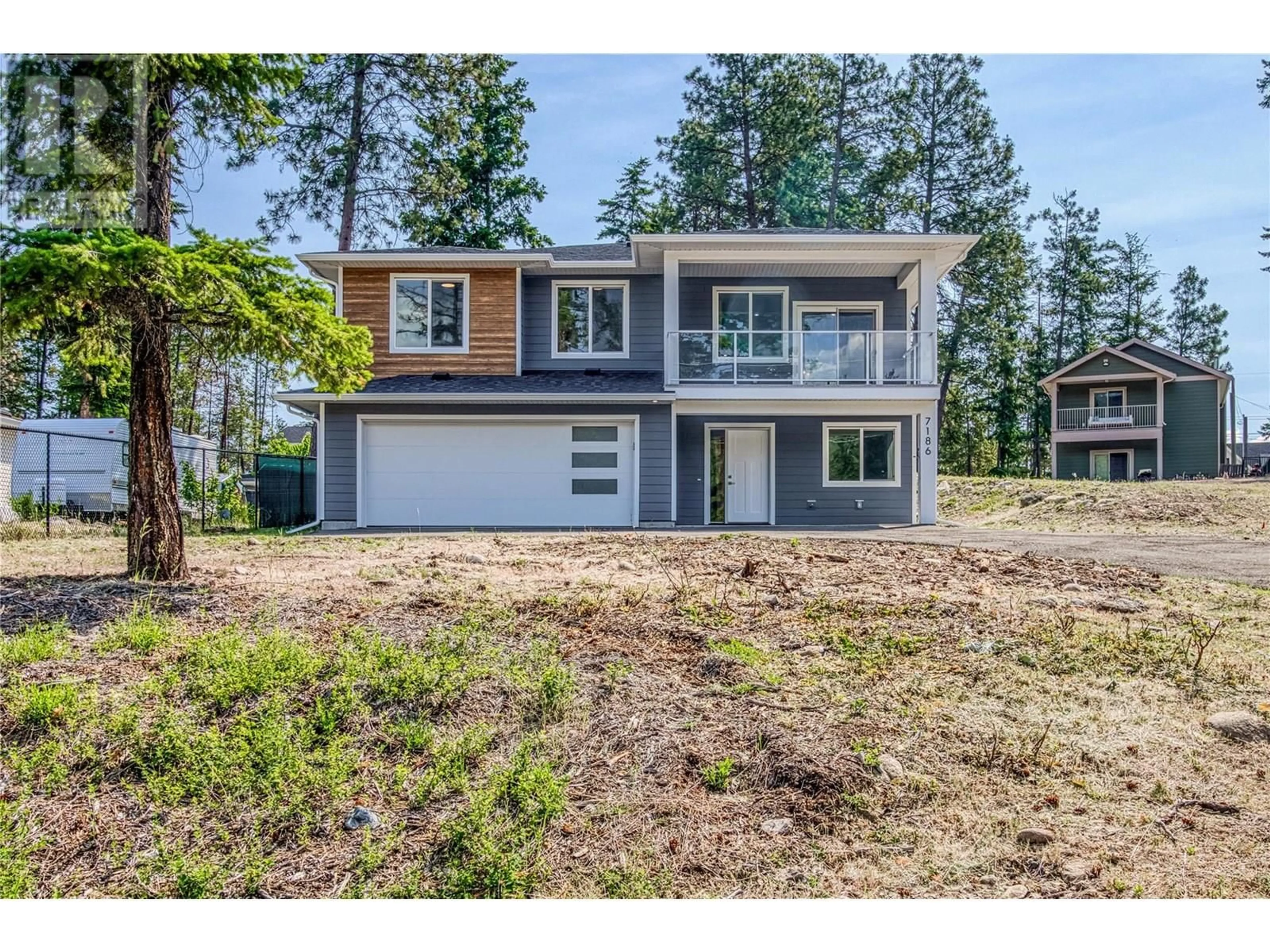 Home with vinyl exterior material, unknown for 7186 DUNWATERS ROAD, Kelowna British Columbia V1Z3W5