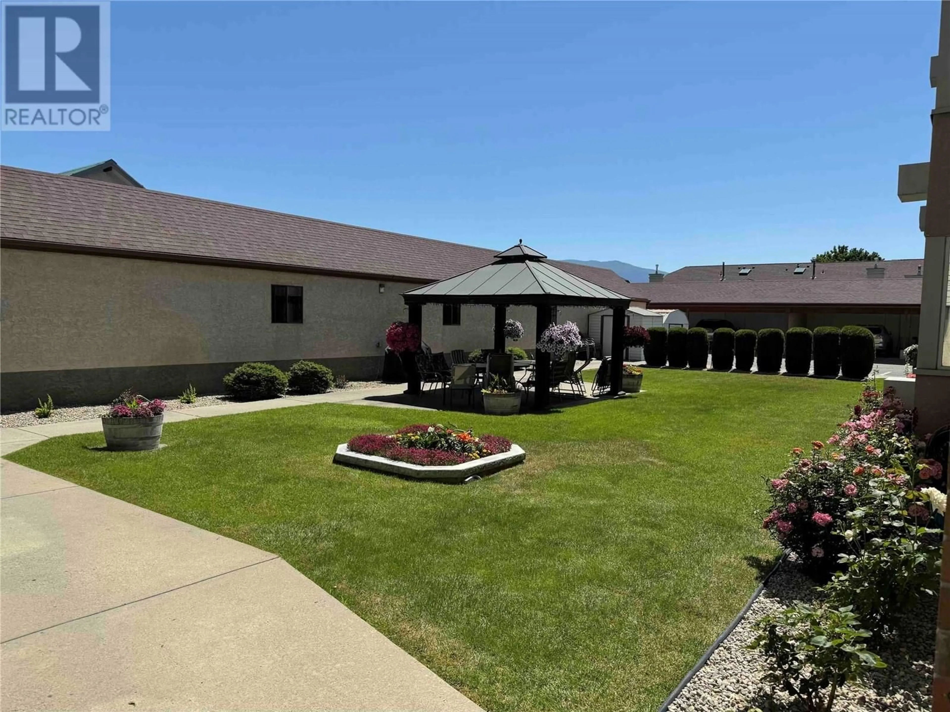 Patio, mountain view for 104 - 1055 GLENWOOD AVENUE, Kelowna British Columbia V1Y5M8