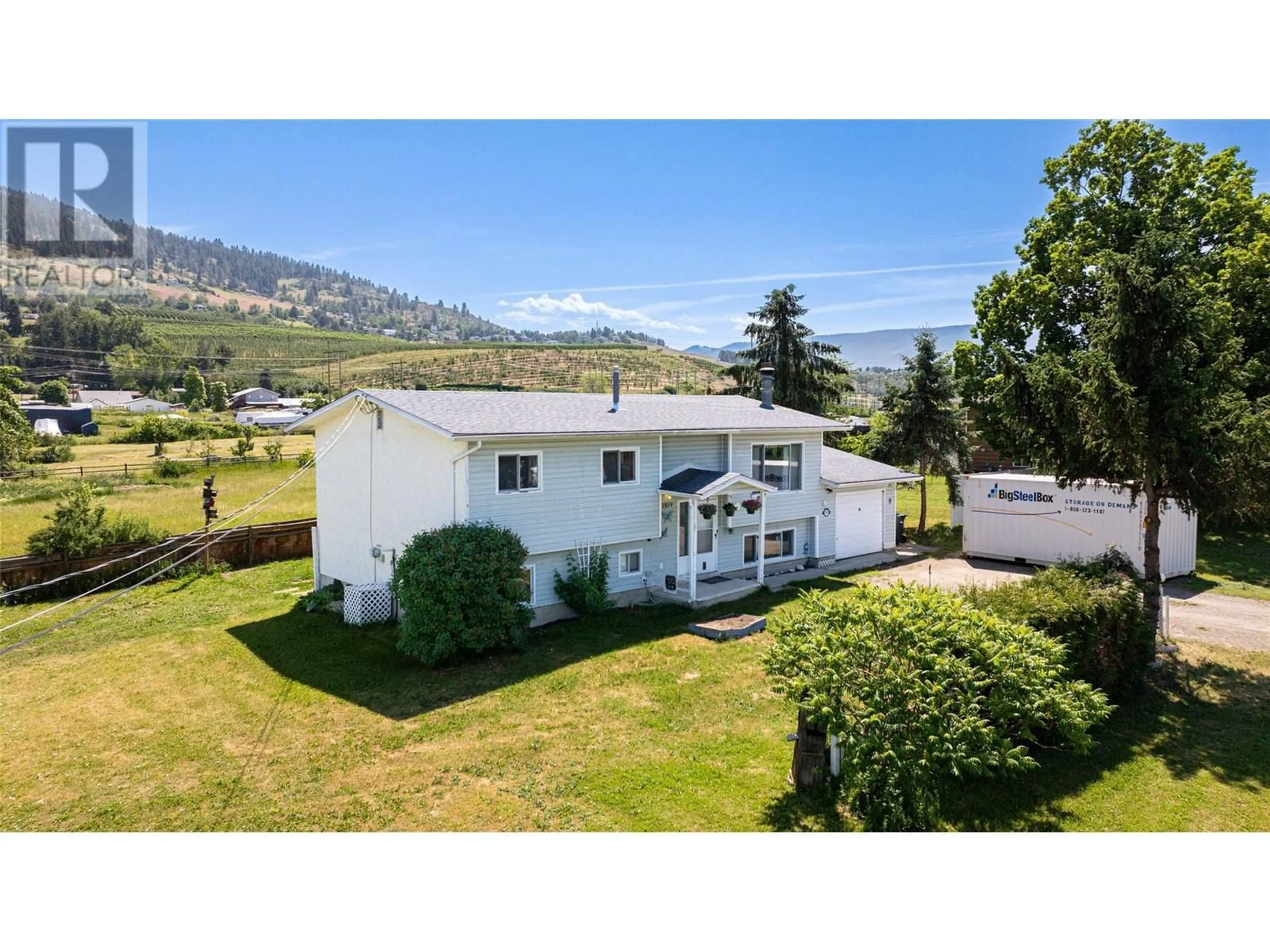 A pic from outside/outdoor area/front of a property/back of a property/a pic from drone, mountain view for 1859 EAST VERNON ROAD, Vernon British Columbia V1B3A7