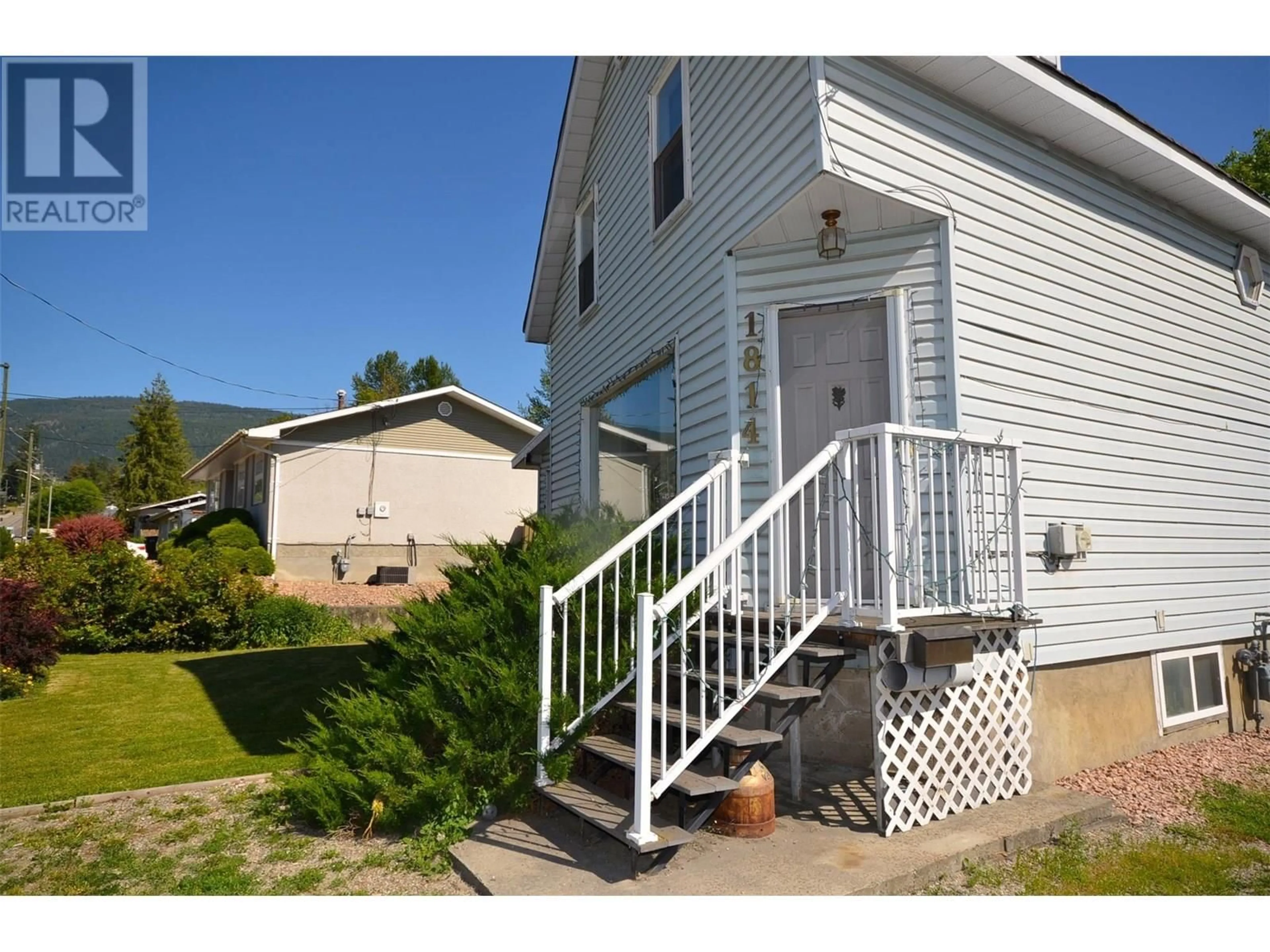 Home with vinyl exterior material, street for 1814 43 AVENUE, Vernon British Columbia V1T3K3