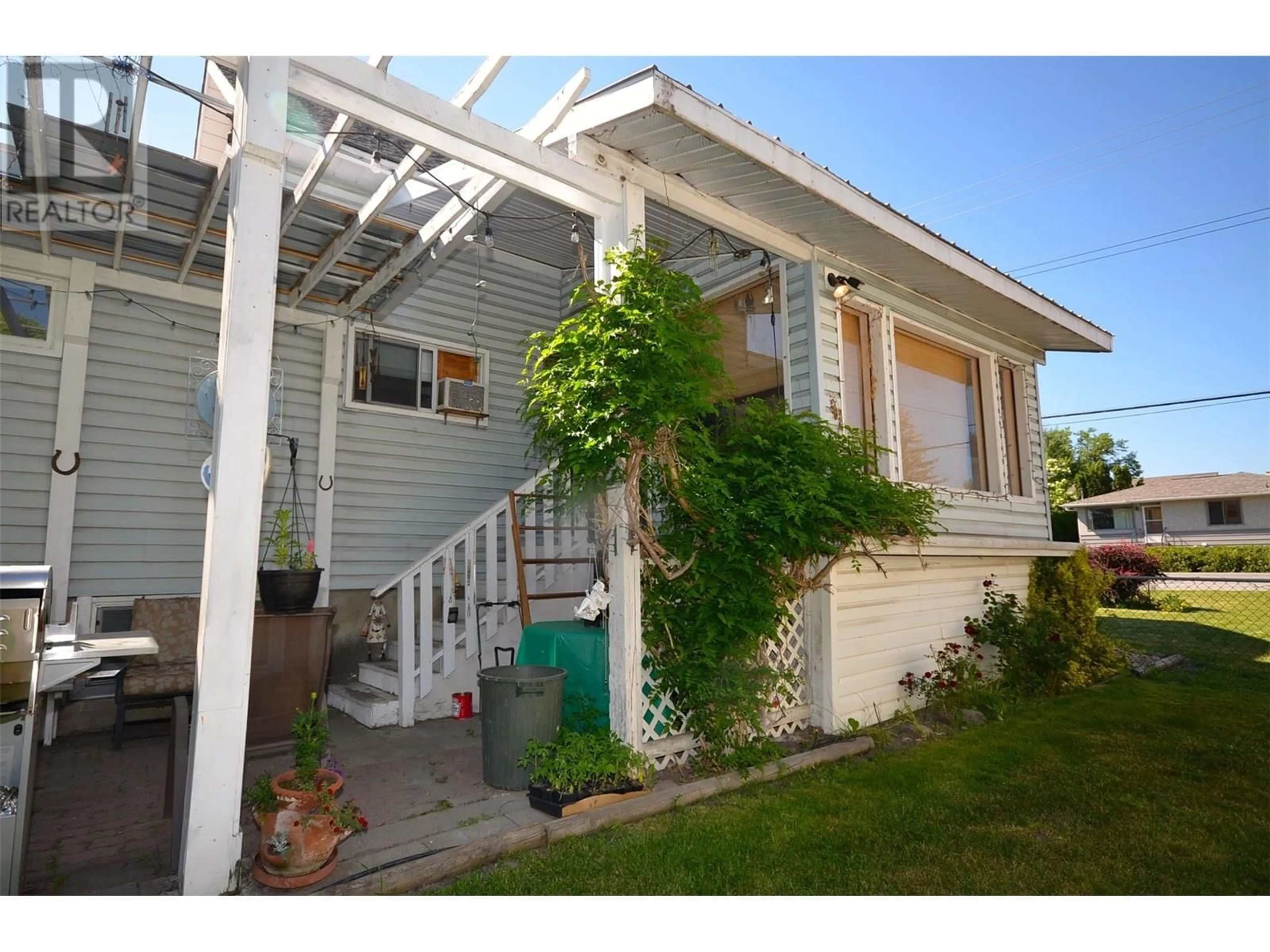 Home with vinyl exterior material, street for 1814 43 AVENUE, Vernon British Columbia V1T3K3