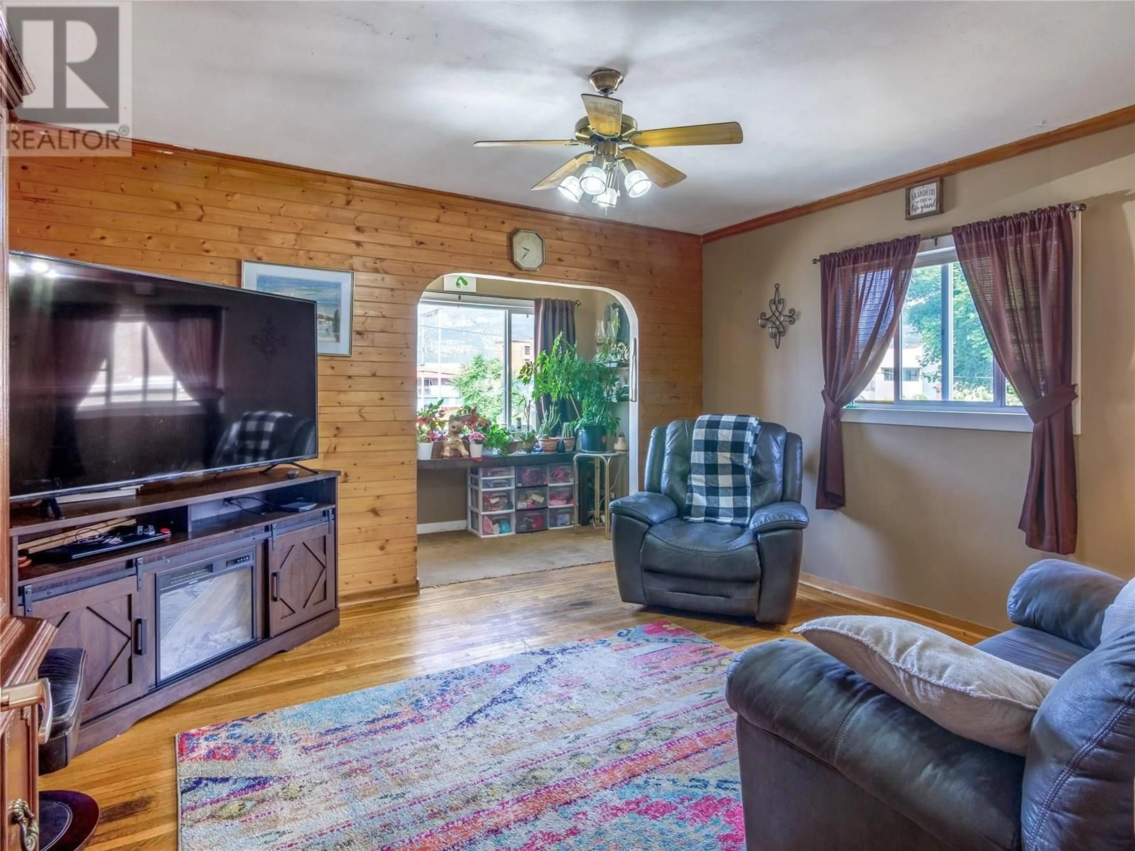 Living room with furniture, wood/laminate floor for 662 ELLIS STREET, Penticton British Columbia V2A4M6