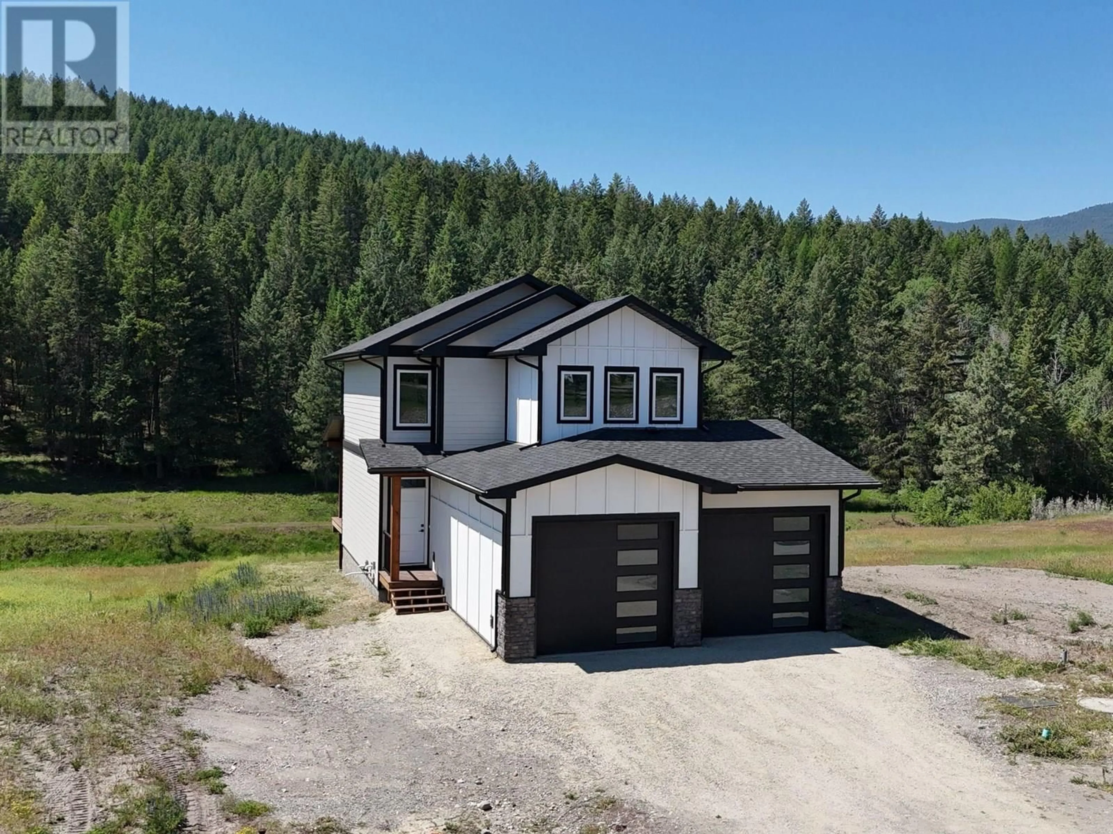 A pic from outside/outdoor area/front of a property/back of a property/a pic from drone, mountain view for 31 LAURIER AVENUE, Wardner British Columbia V0B2J0
