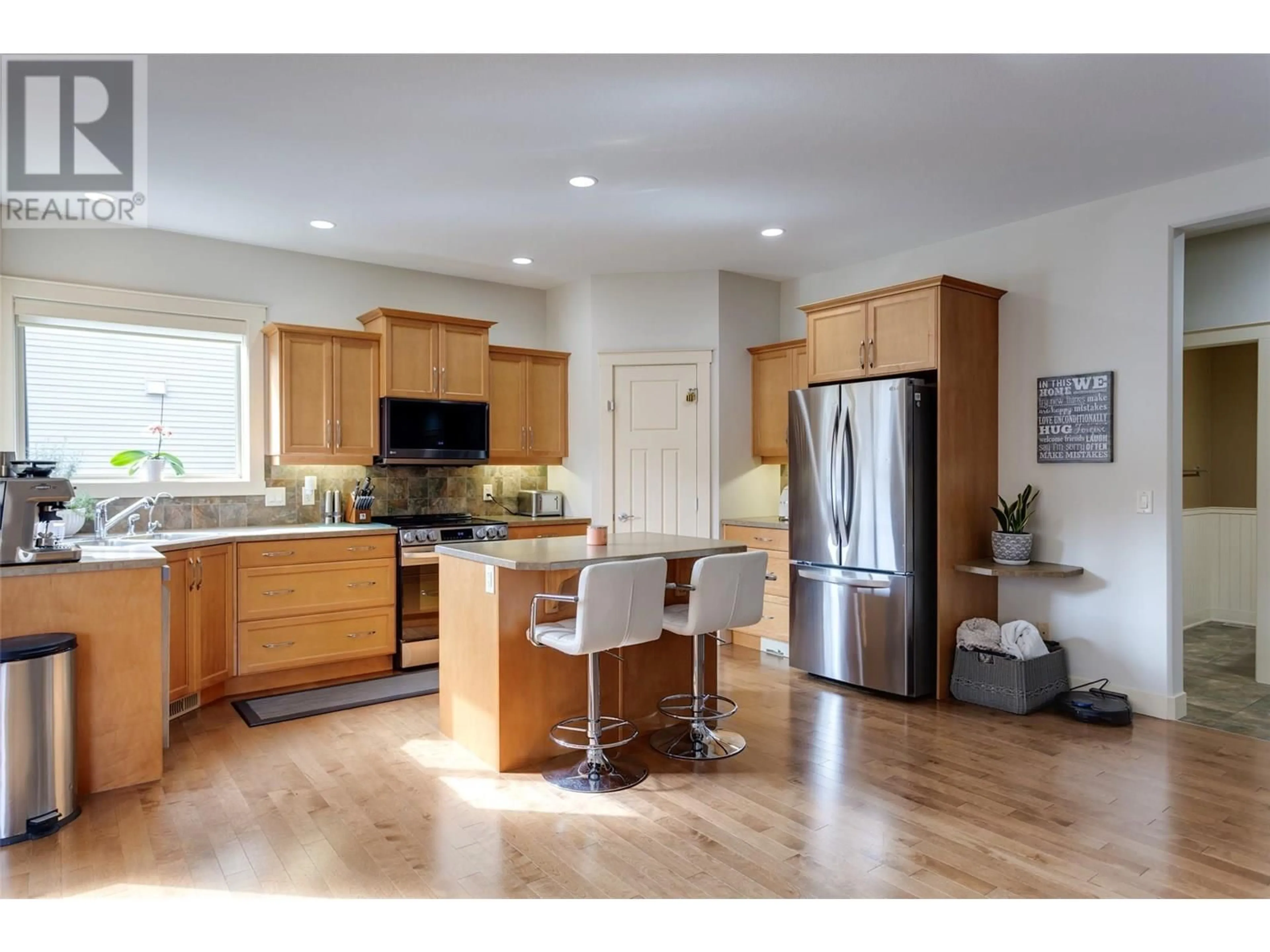Open concept kitchen, wood/laminate floor for 2841 BENTLEY ROAD, West Kelowna British Columbia V4T3B2