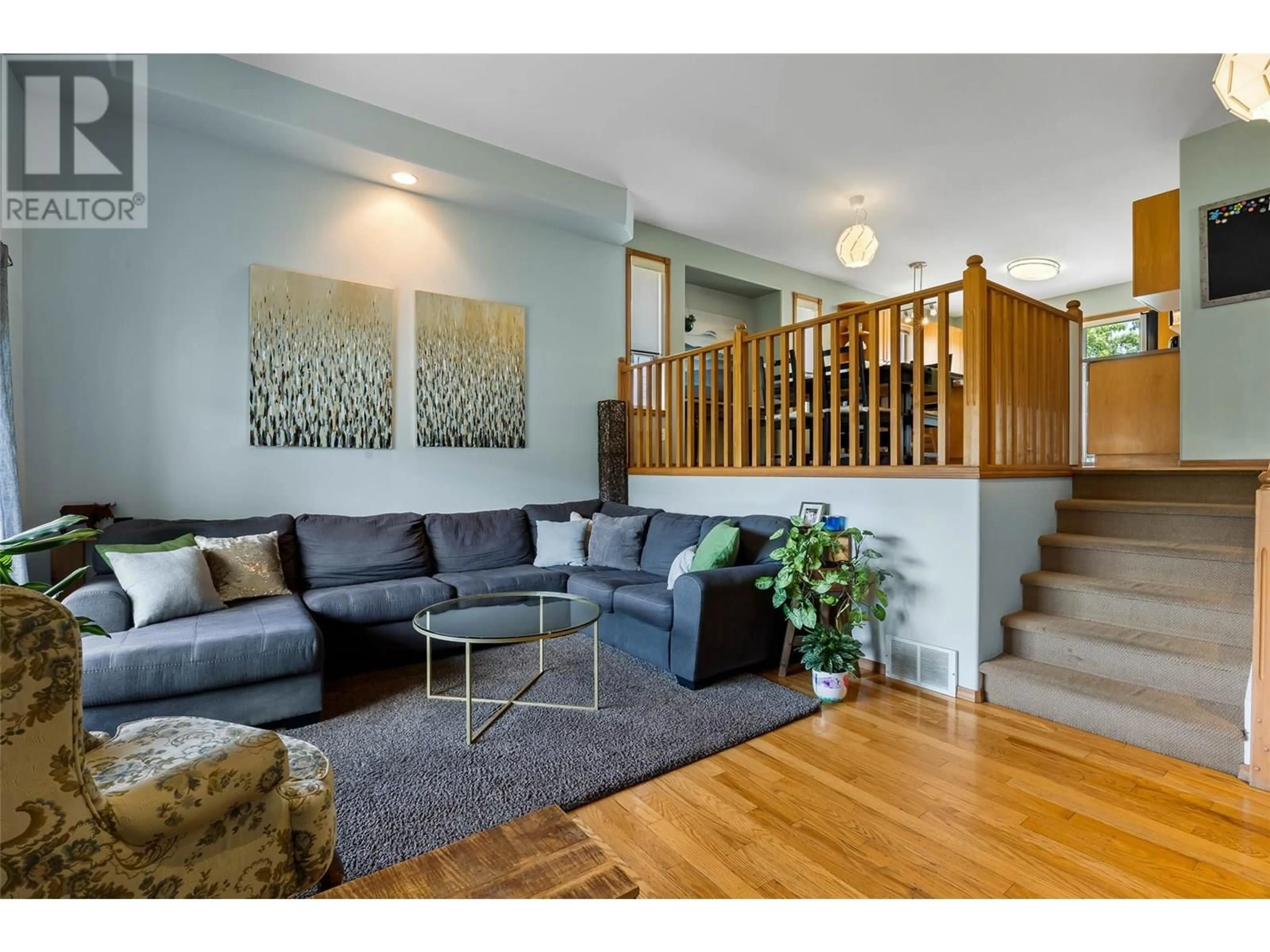 Living room with furniture, wood/laminate floor for 745 BRAMBLE COURT, Kamloops British Columbia V1S1Z5