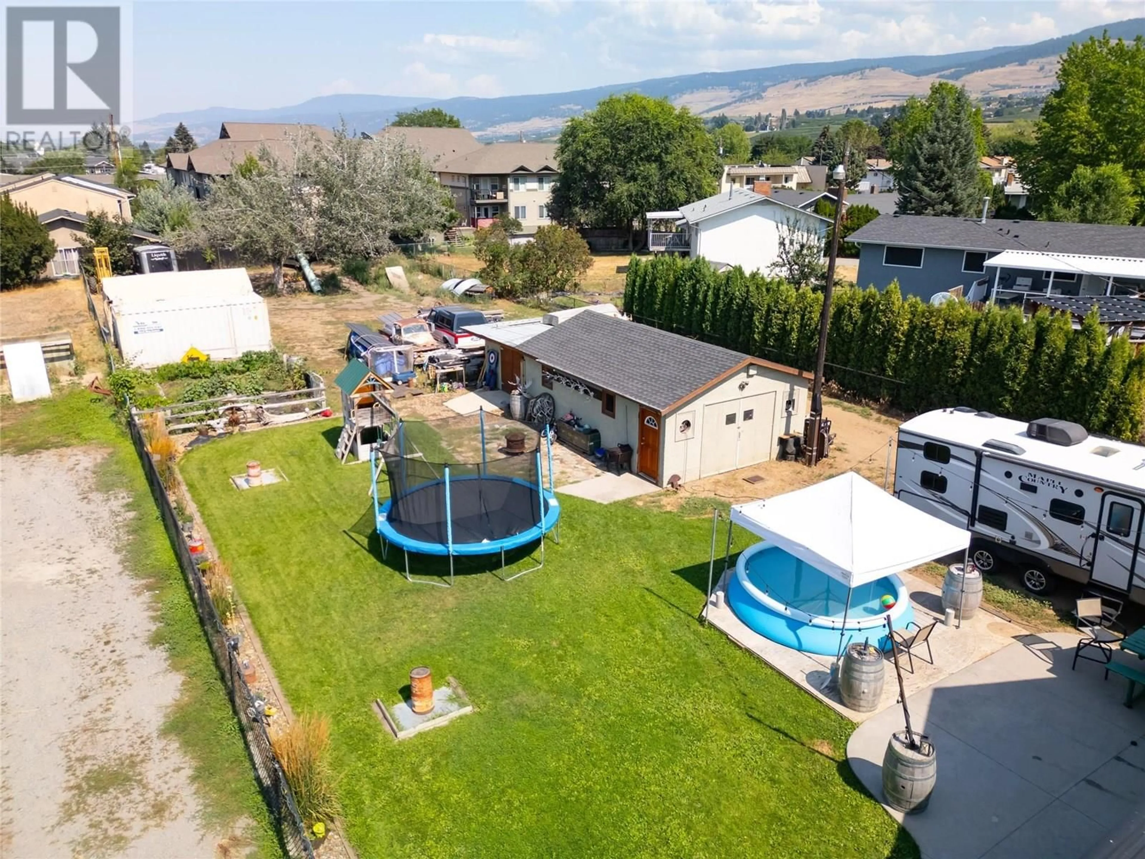 A pic from outside/outdoor area/front of a property/back of a property/a pic from drone, mountain view for 170 MUGFORD ROAD, Kelowna British Columbia V1X2E2
