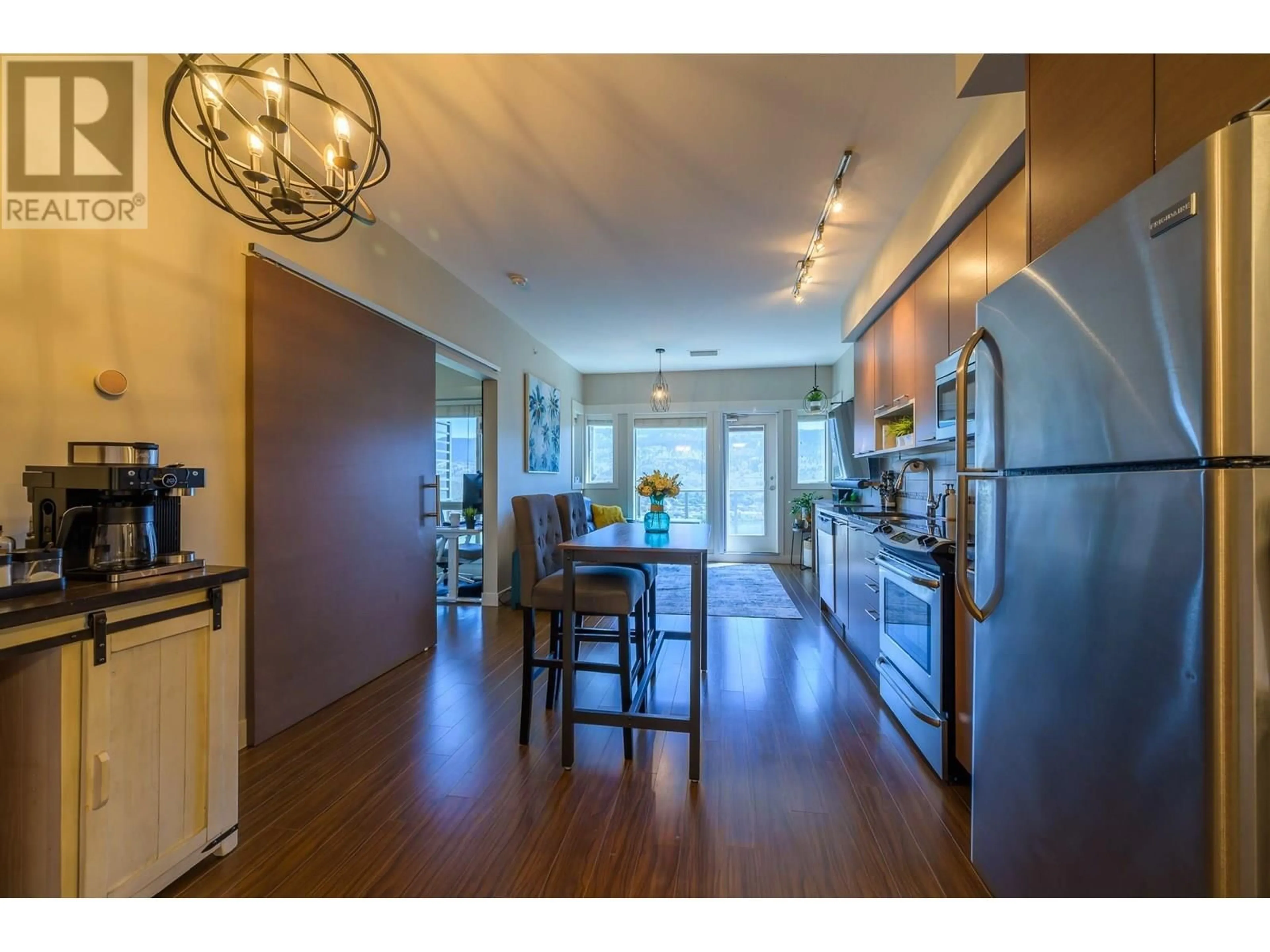 Open concept kitchen, wood/laminate floor for 3410 - 1040 TALASA WAY, Kamloops British Columbia V2H0C4