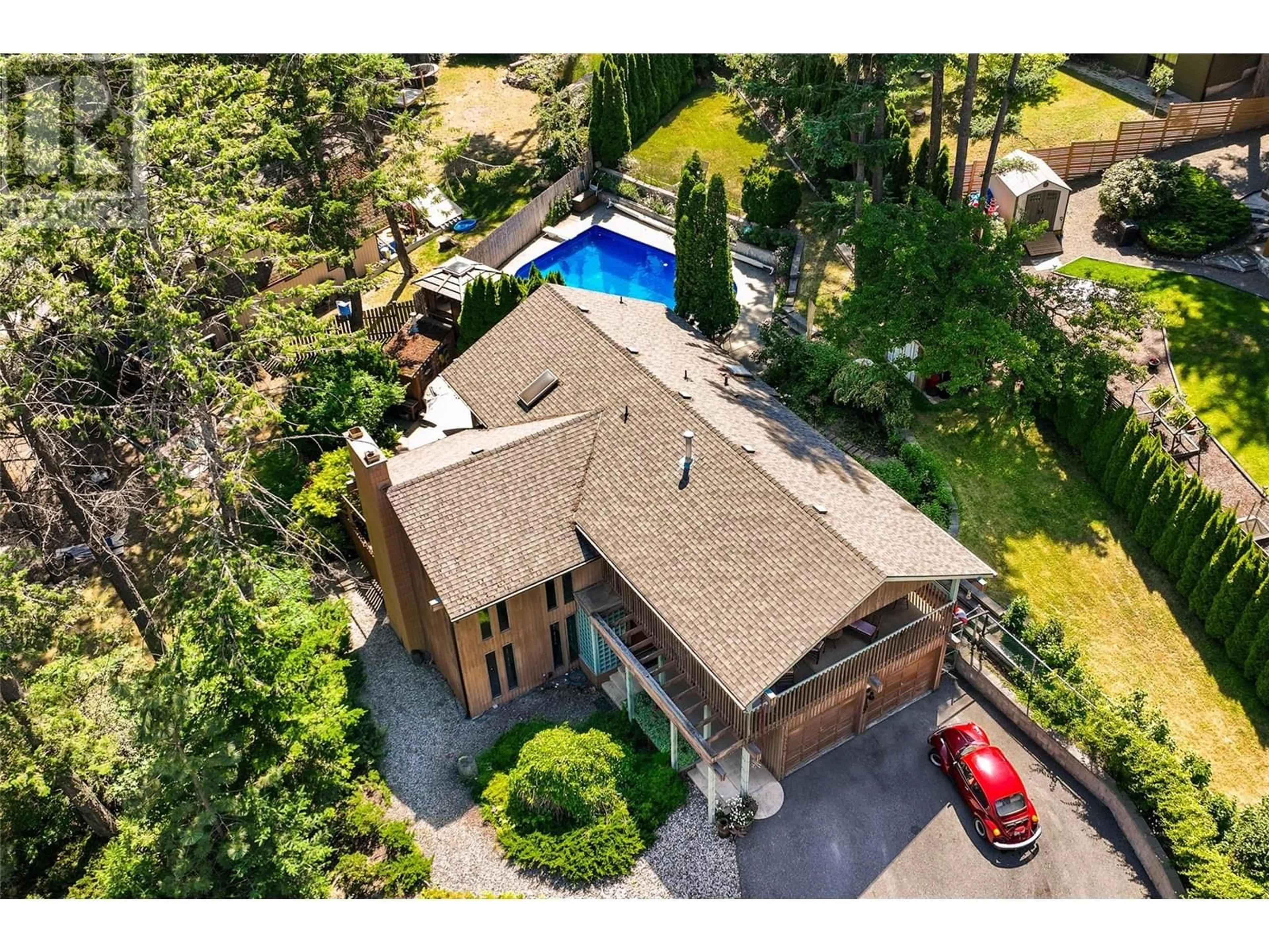 A pic from outside/outdoor area/front of a property/back of a property/a pic from drone, street for 1584 PARKINSON ROAD, West Kelowna British Columbia V1Z2X2