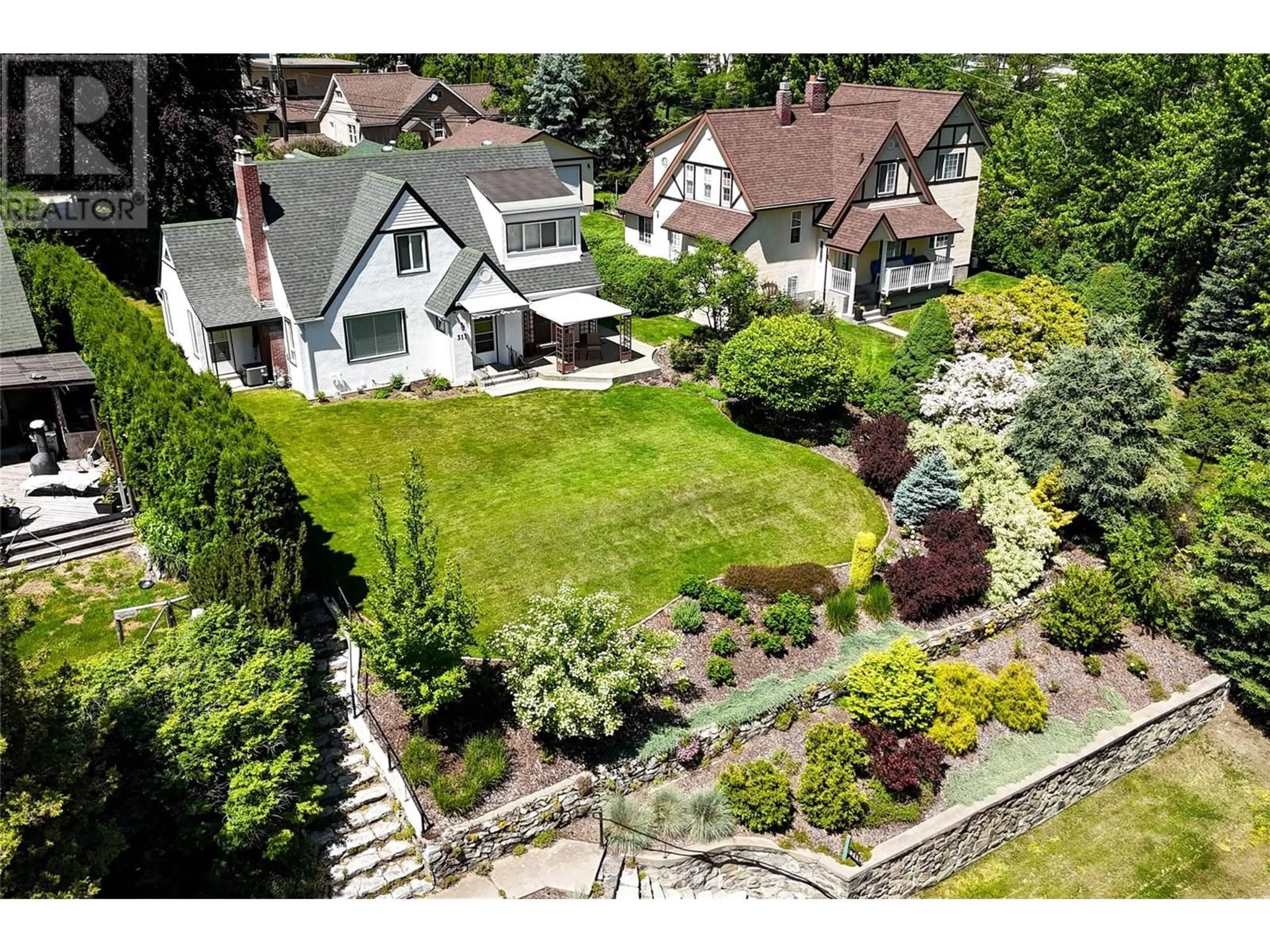 A pic from outside/outdoor area/front of a property/back of a property/a pic from drone, street for 311 MURRAY DRIVE, Warfield British Columbia V1R2J5