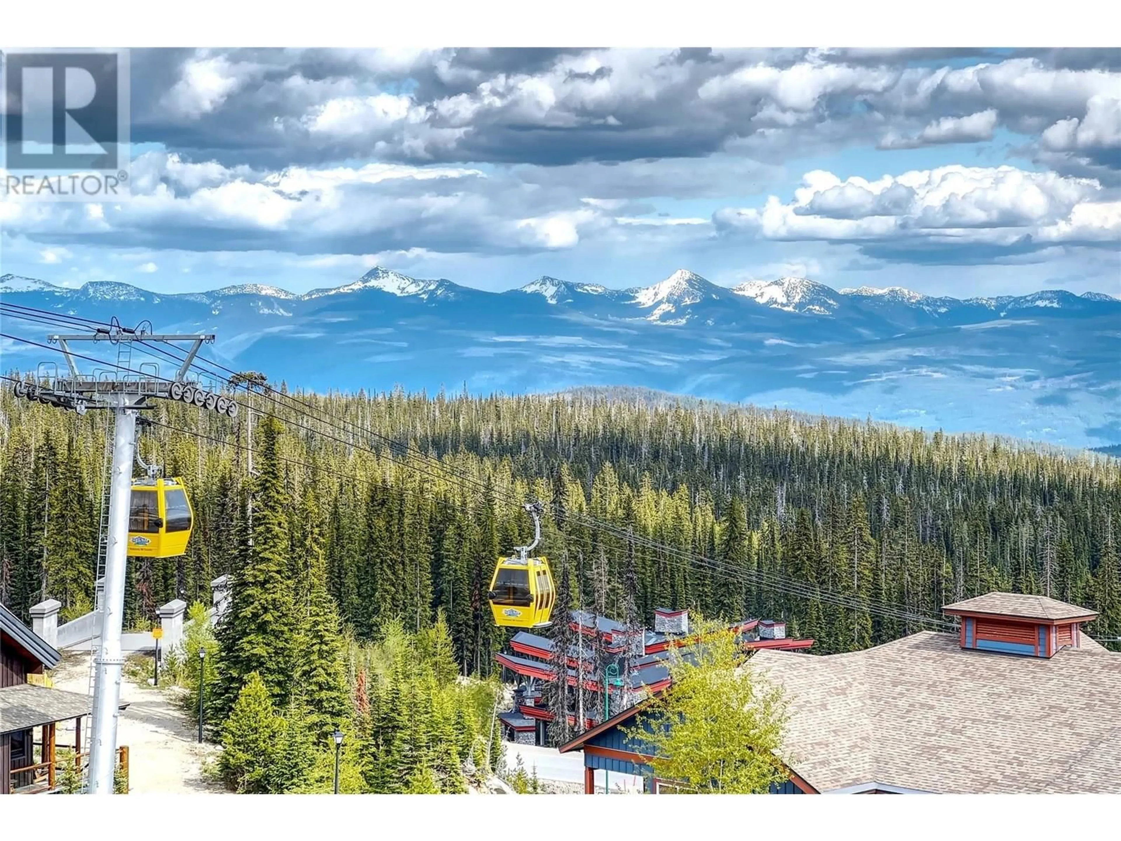 A pic from outside/outdoor area/front of a property/back of a property/a pic from drone, mountain view for 101C - 375 RAVEN RIDGE ROAD, Big White British Columbia V1P1P3