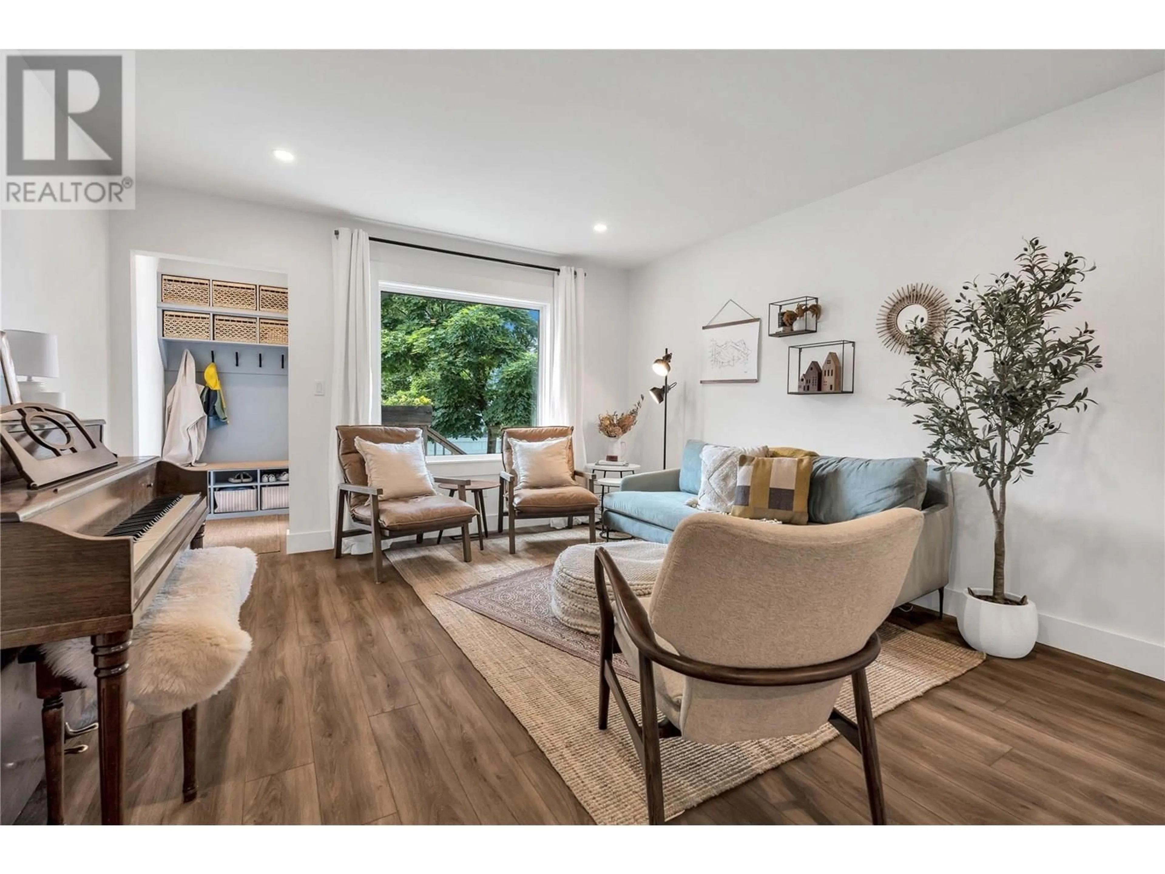 Living room with furniture, wood/laminate floor for 351 ECKHARDT AVENUE EAST, Penticton British Columbia V2A1Z7