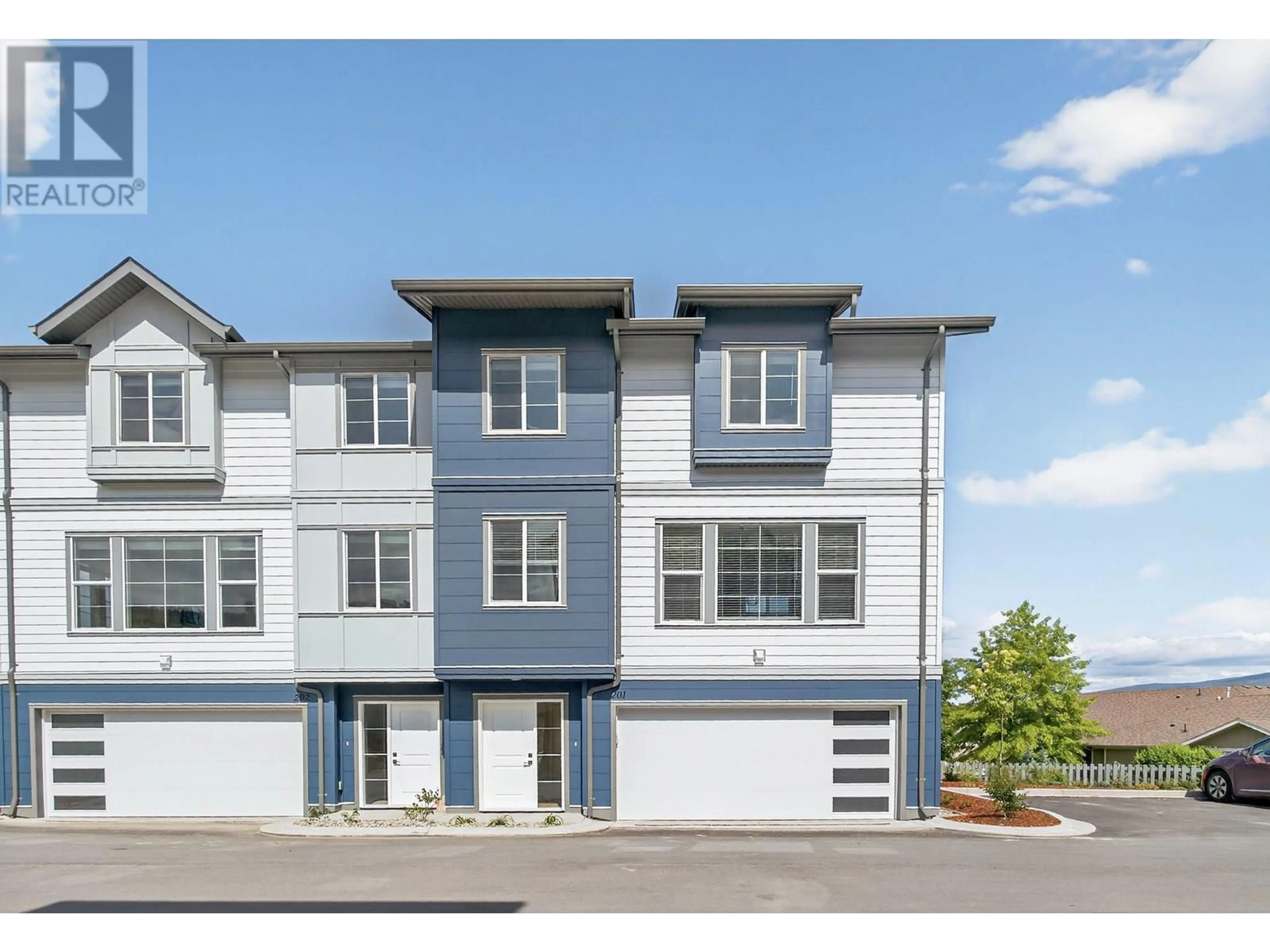 Home with vinyl exterior material, street for 201 - 4025 GELLATLY ROAD, West Kelowna British Columbia V4T0E6