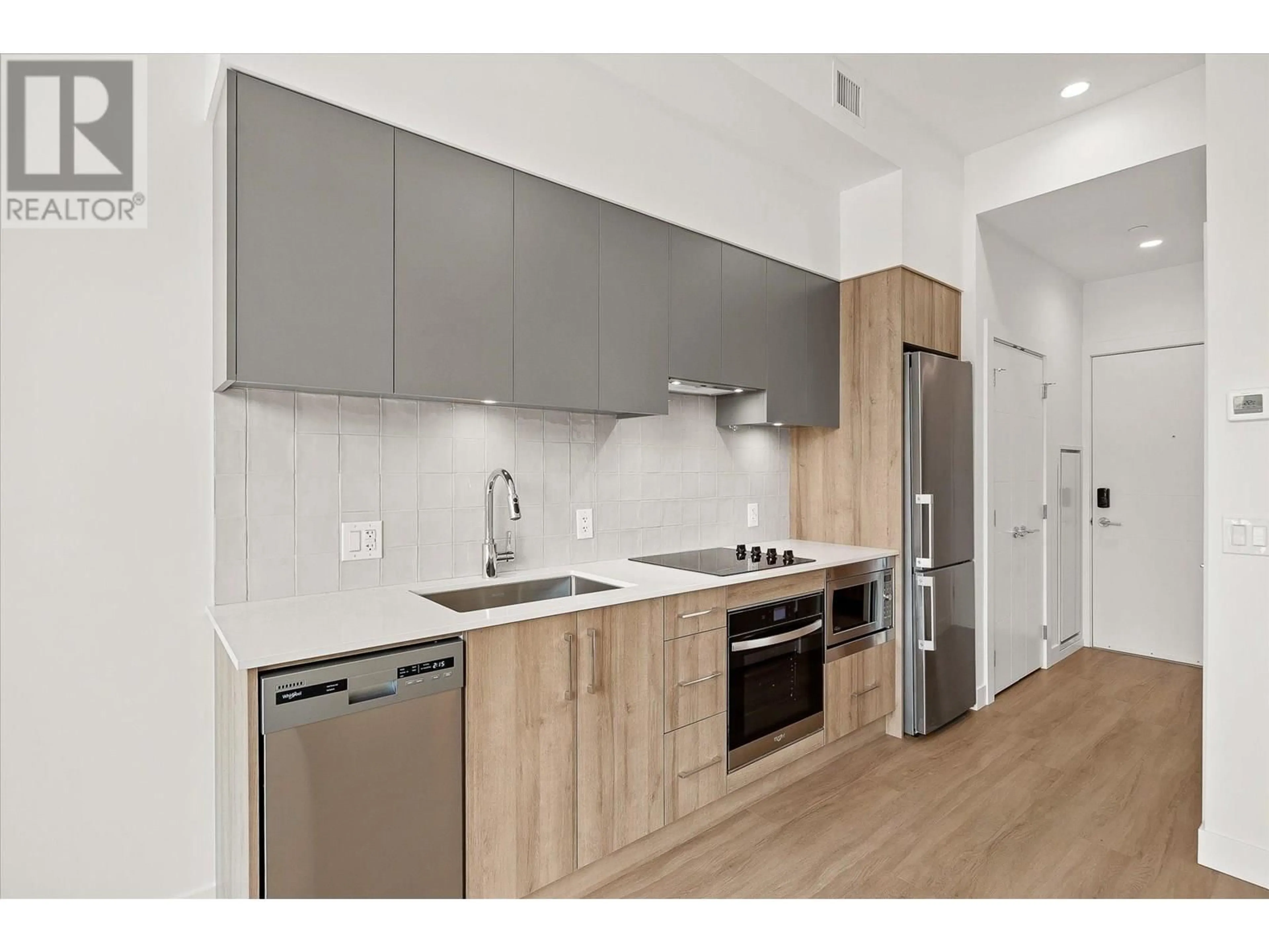 Standard kitchen, wood/laminate floor for 102 - 3699 CAPOZZI ROAD, Kelowna British Columbia V1W0G3