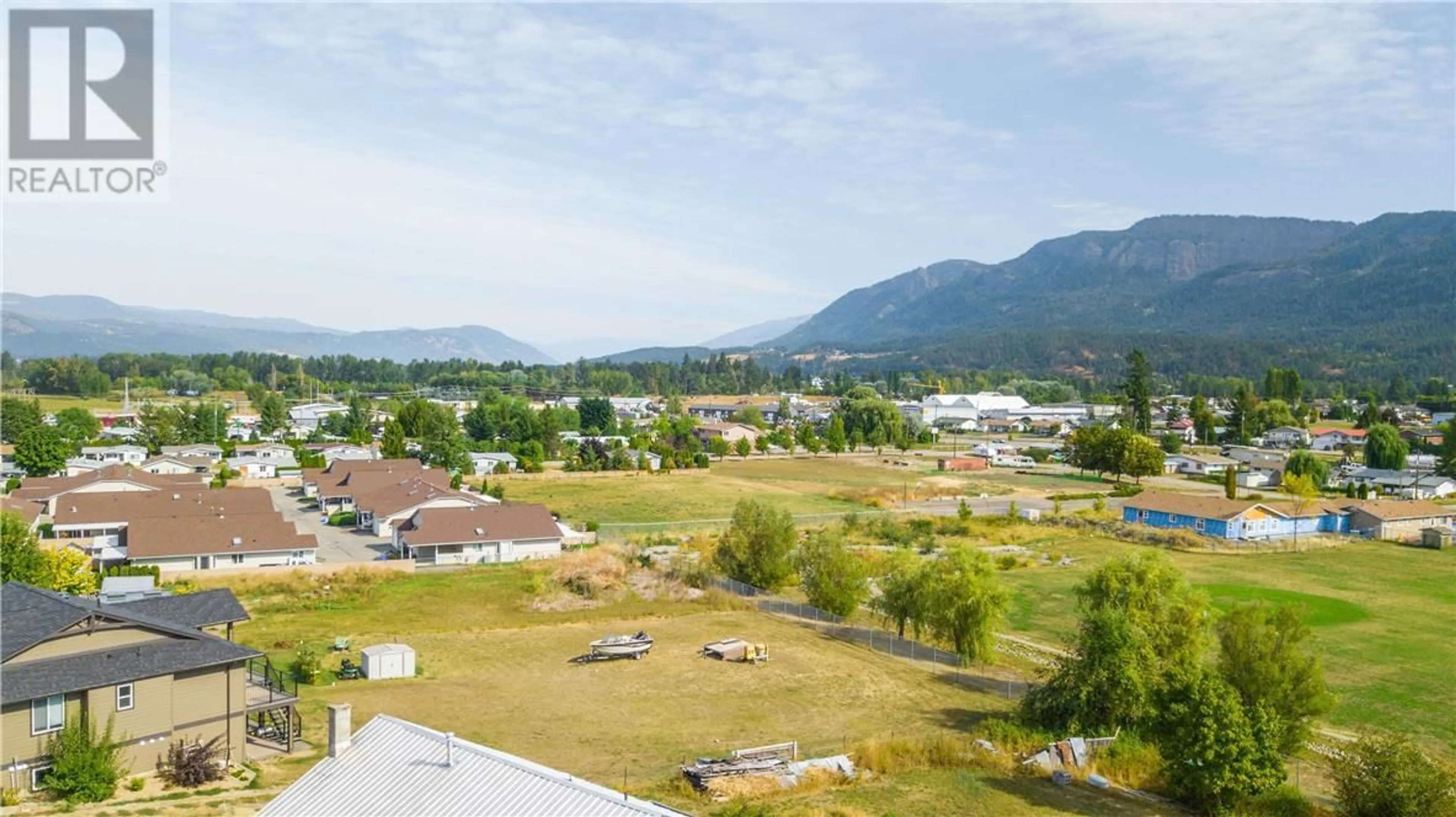 A pic from outside/outdoor area/front of a property/back of a property/a pic from drone, mountain view for 126 SALMON ARM DRIVE, Enderby British Columbia V0E1V0