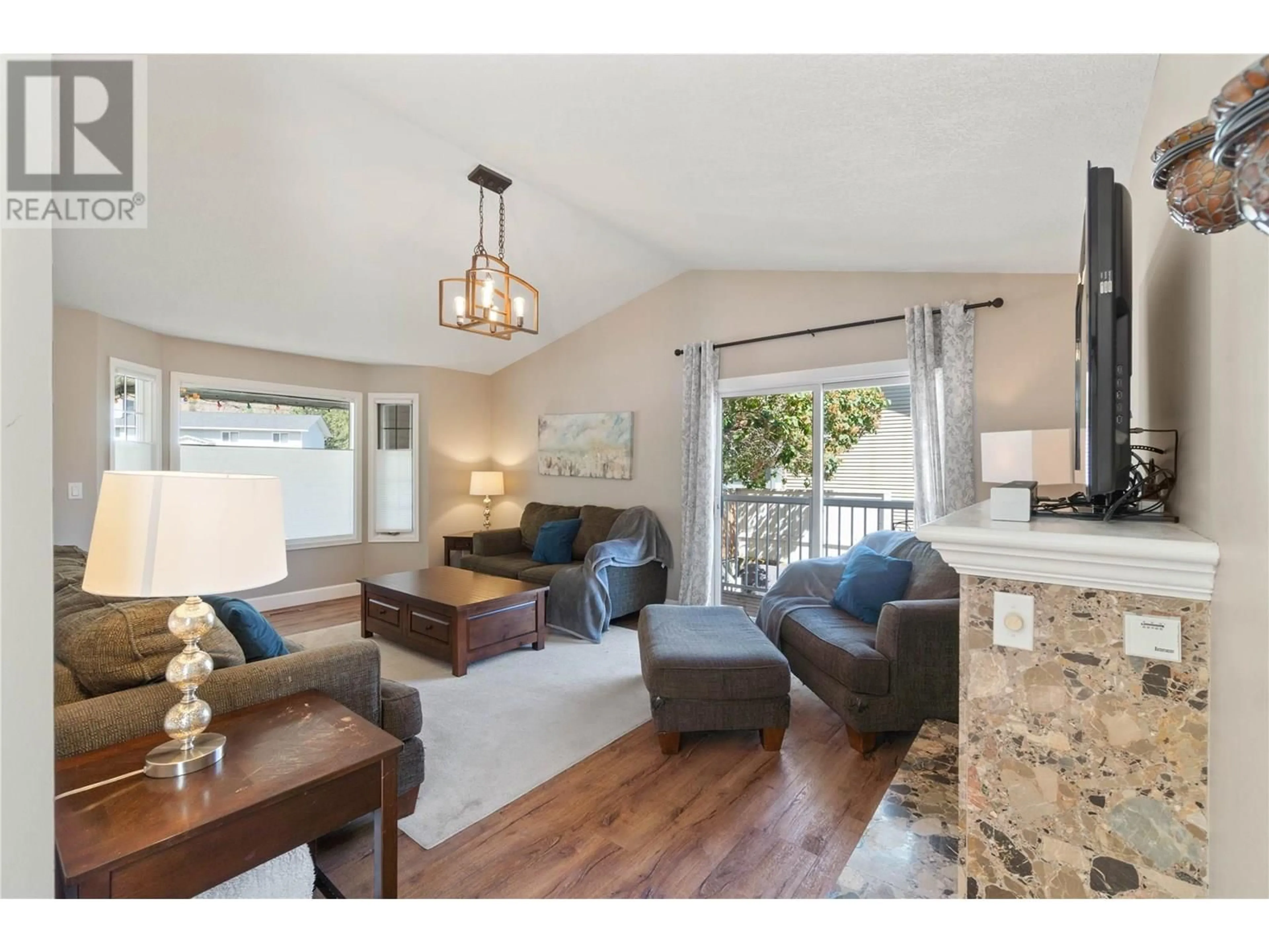 Living room with furniture, wood/laminate floor for 3225 HARGRAVES PLACE, Kamloops British Columbia V2B8H3