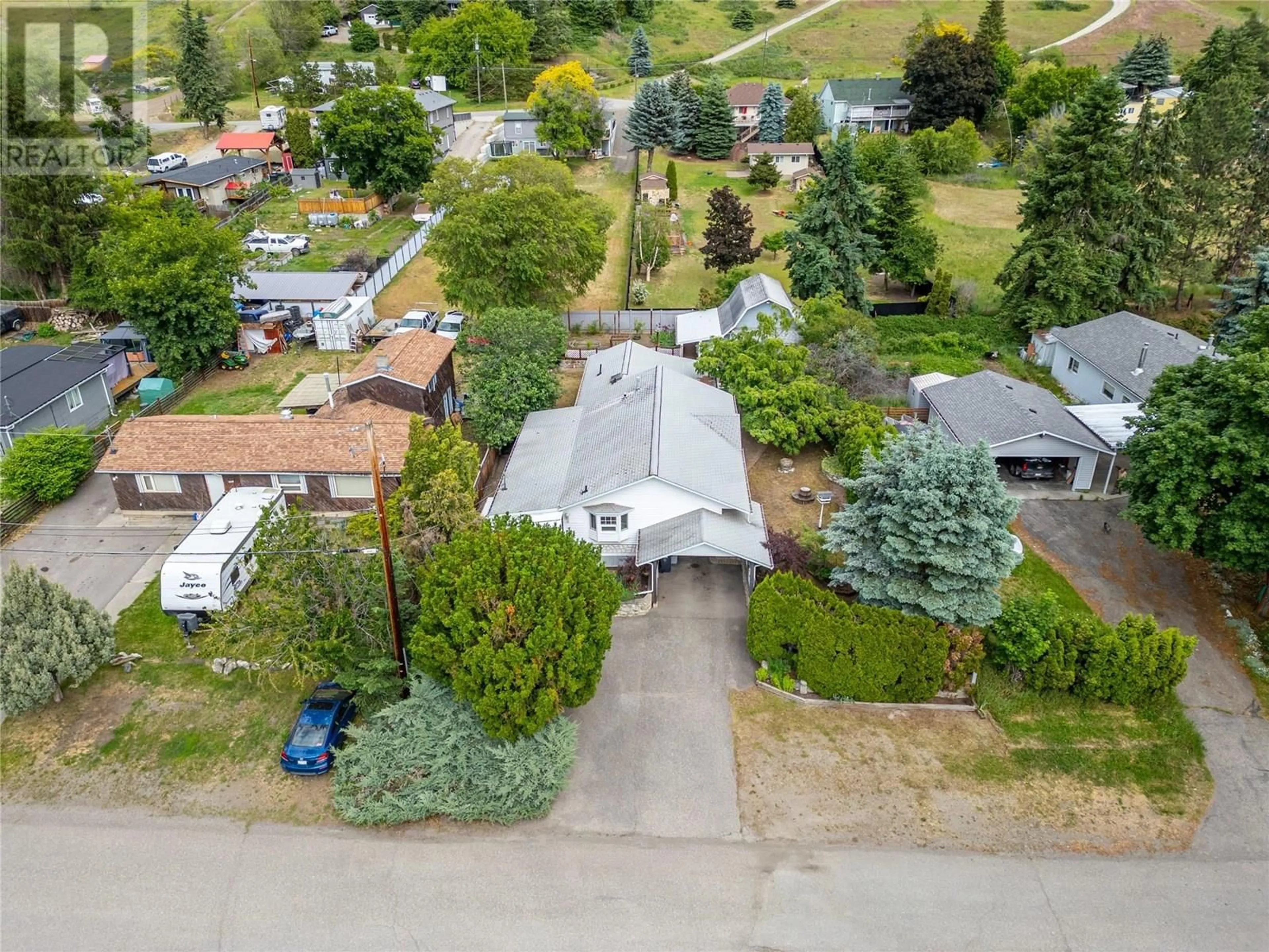A pic from outside/outdoor area/front of a property/back of a property/a pic from drone, street for 6641 GIBBS ROAD, Vernon British Columbia V1B3T2