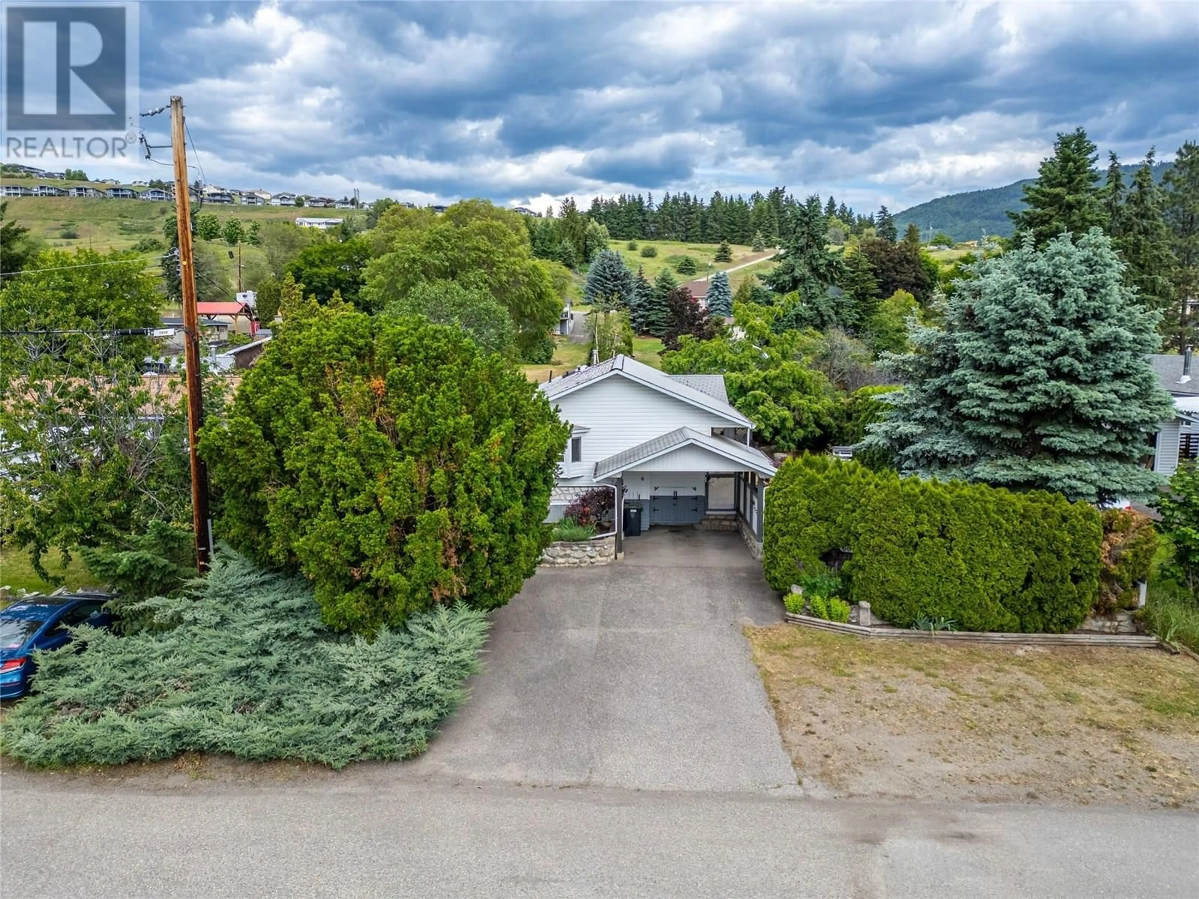 A pic from outside/outdoor area/front of a property/back of a property/a pic from drone, mountain view for 6641 GIBBS ROAD, Vernon British Columbia V1B3T2