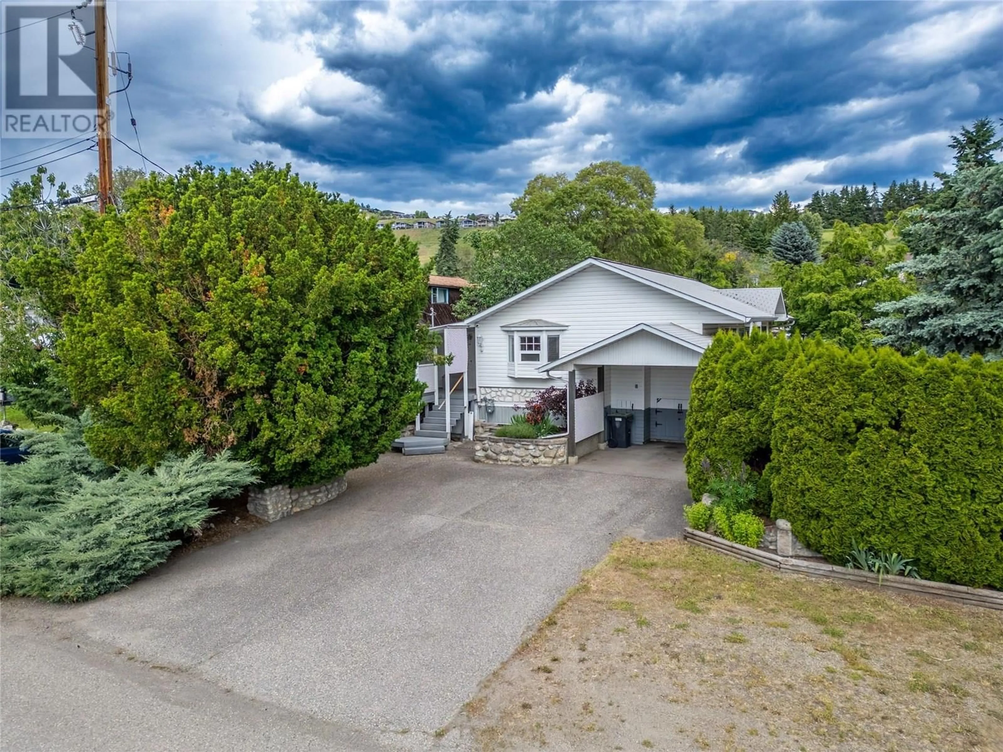 A pic from outside/outdoor area/front of a property/back of a property/a pic from drone, street for 6641 GIBBS ROAD, Vernon British Columbia V1B3T2