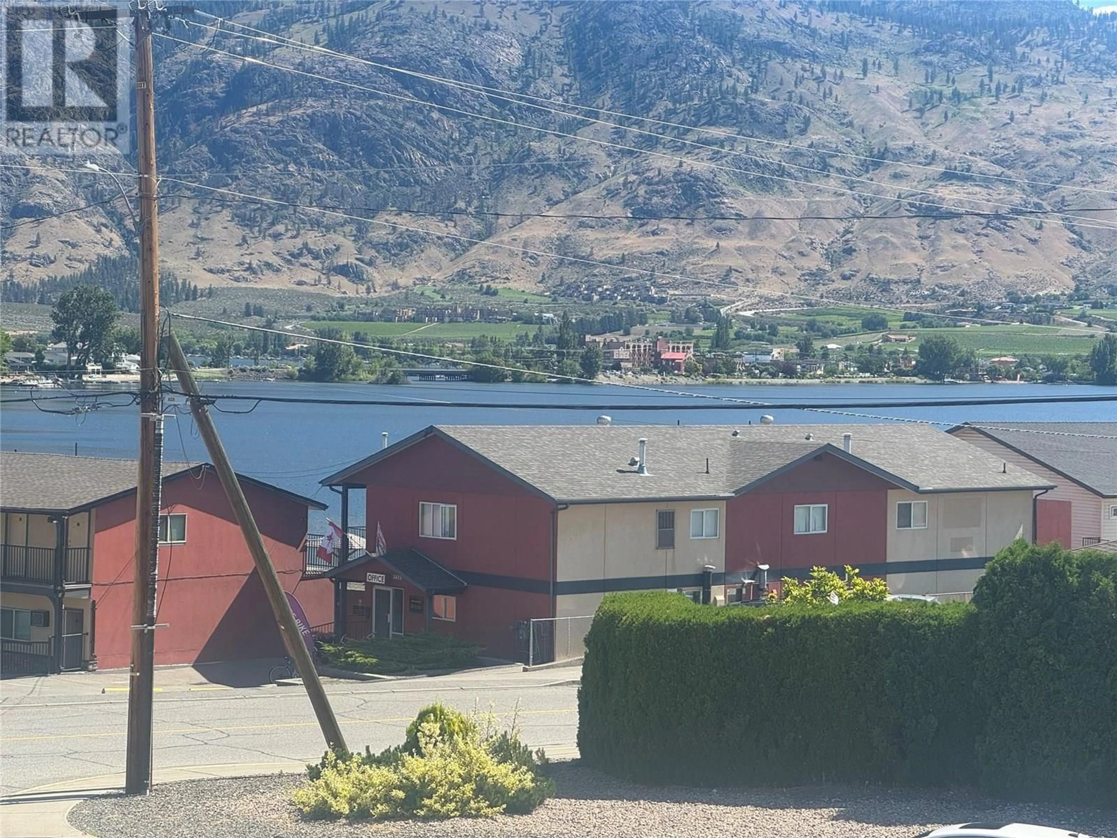 A pic from outside/outdoor area/front of a property/back of a property/a pic from drone, mountain view for 204 - 5820 89TH STREET, Osoyoos British Columbia V0H1V1