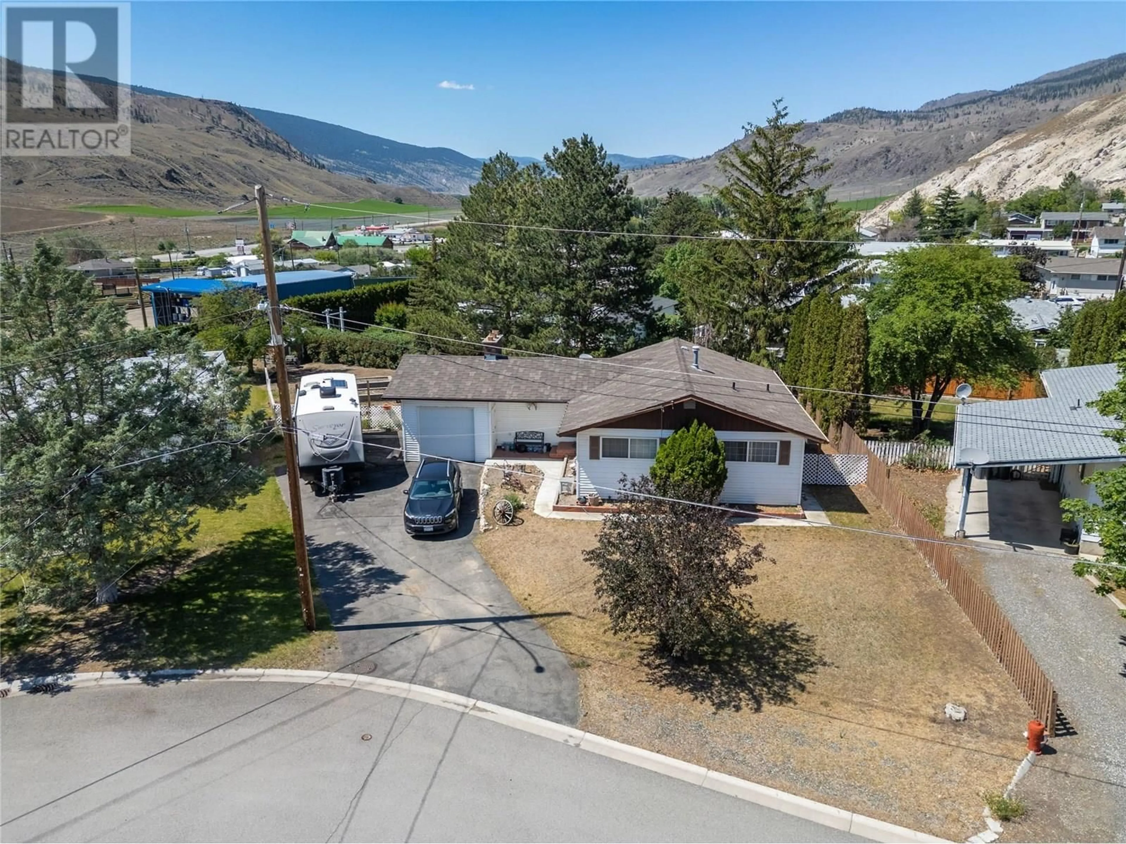 A pic from outside/outdoor area/front of a property/back of a property/a pic from drone, mountain view for 1111 MACLEAN CRESCENT, Cache Creek British Columbia V0K1H0