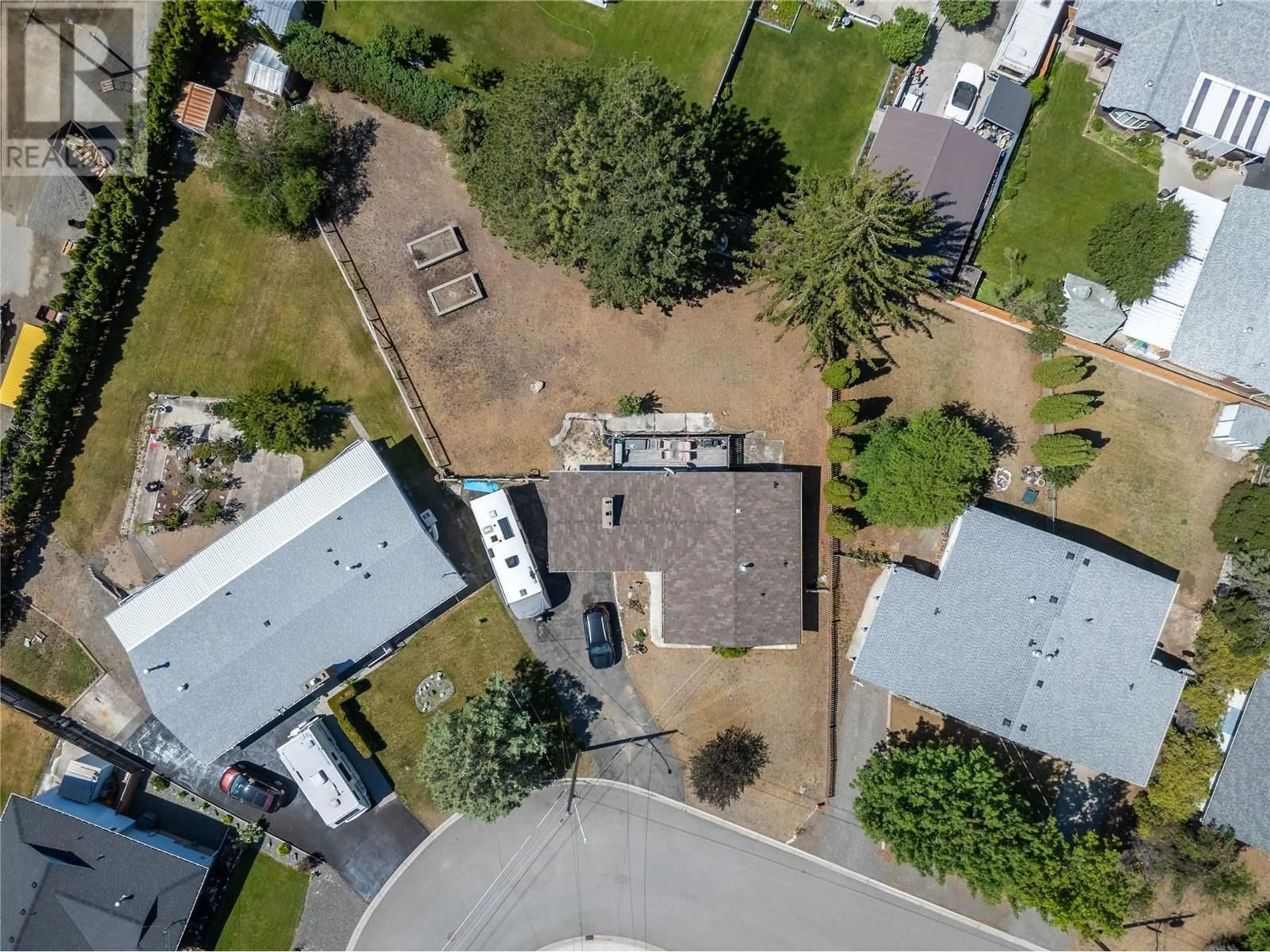 A pic from outside/outdoor area/front of a property/back of a property/a pic from drone, street for 1111 MACLEAN CRESCENT, Cache Creek British Columbia V0K1H0