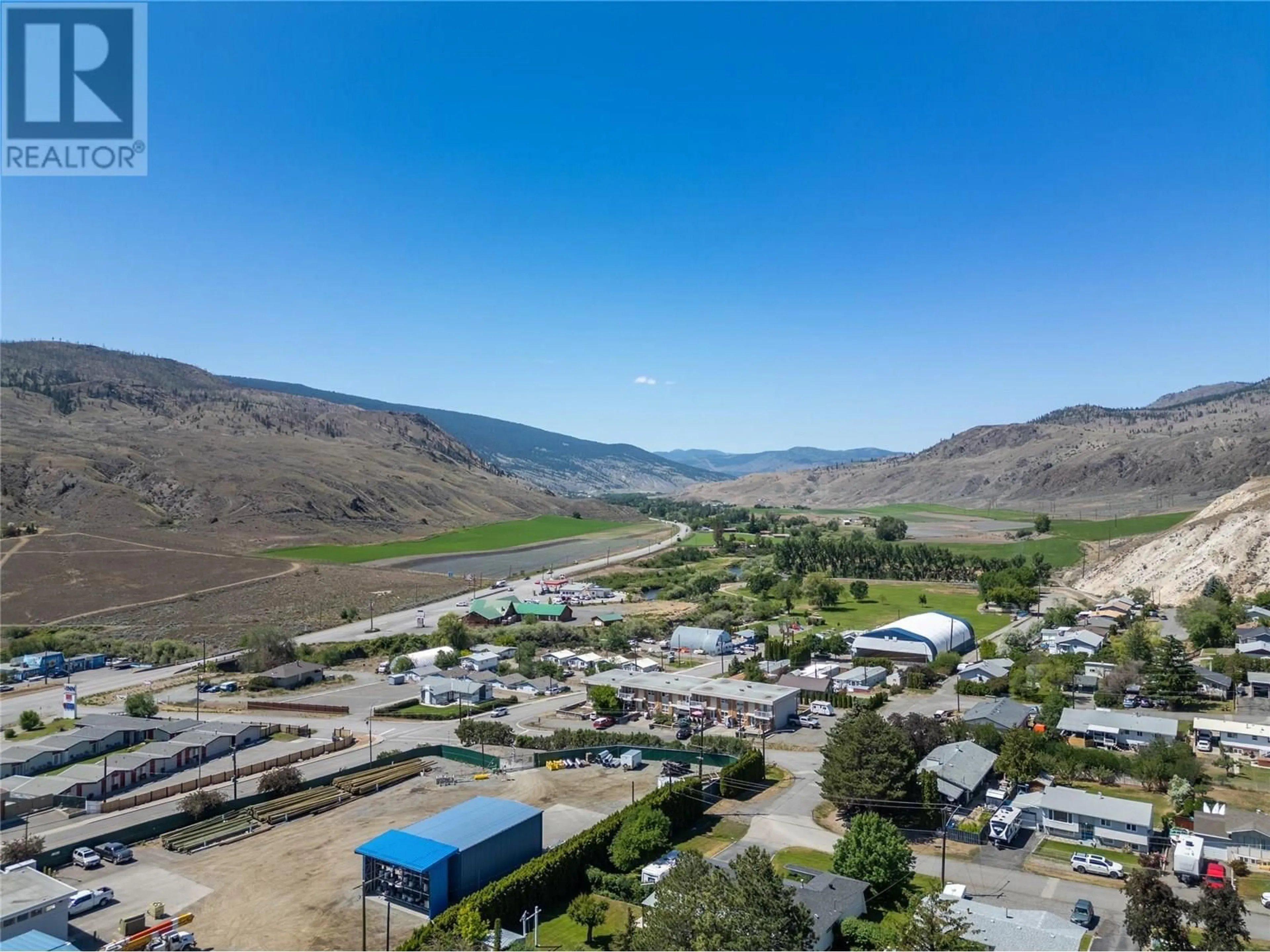A pic from outside/outdoor area/front of a property/back of a property/a pic from drone, mountain view for 1111 MACLEAN CRESCENT, Cache Creek British Columbia V0K1H0