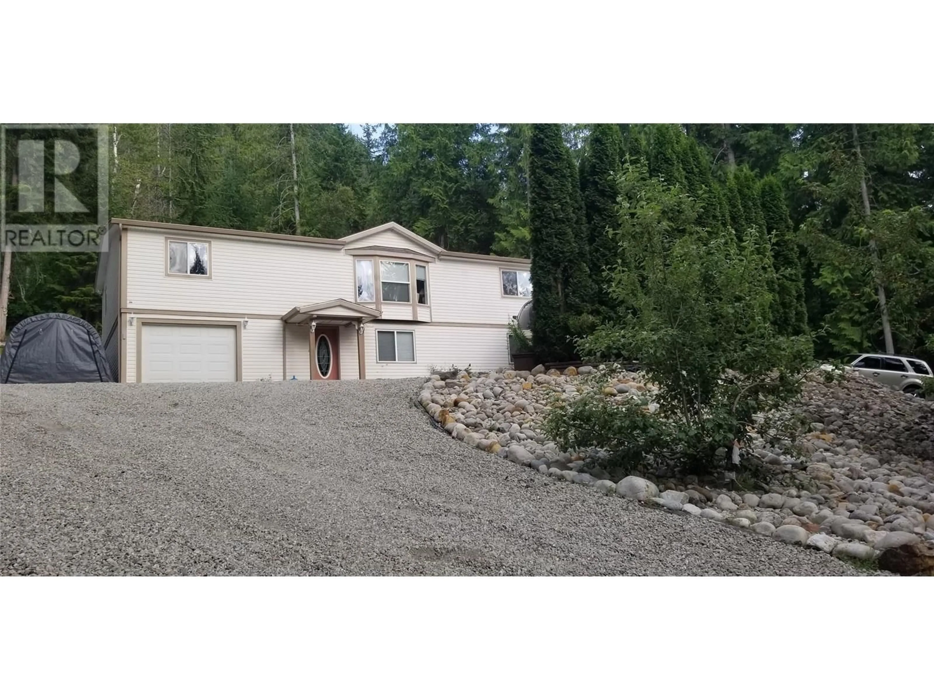 A pic from outside/outdoor area/front of a property/back of a property/a pic from drone, unknown for 9000 HUMMINGBIRD DRIVE, Swansea Point British Columbia V0E2K2