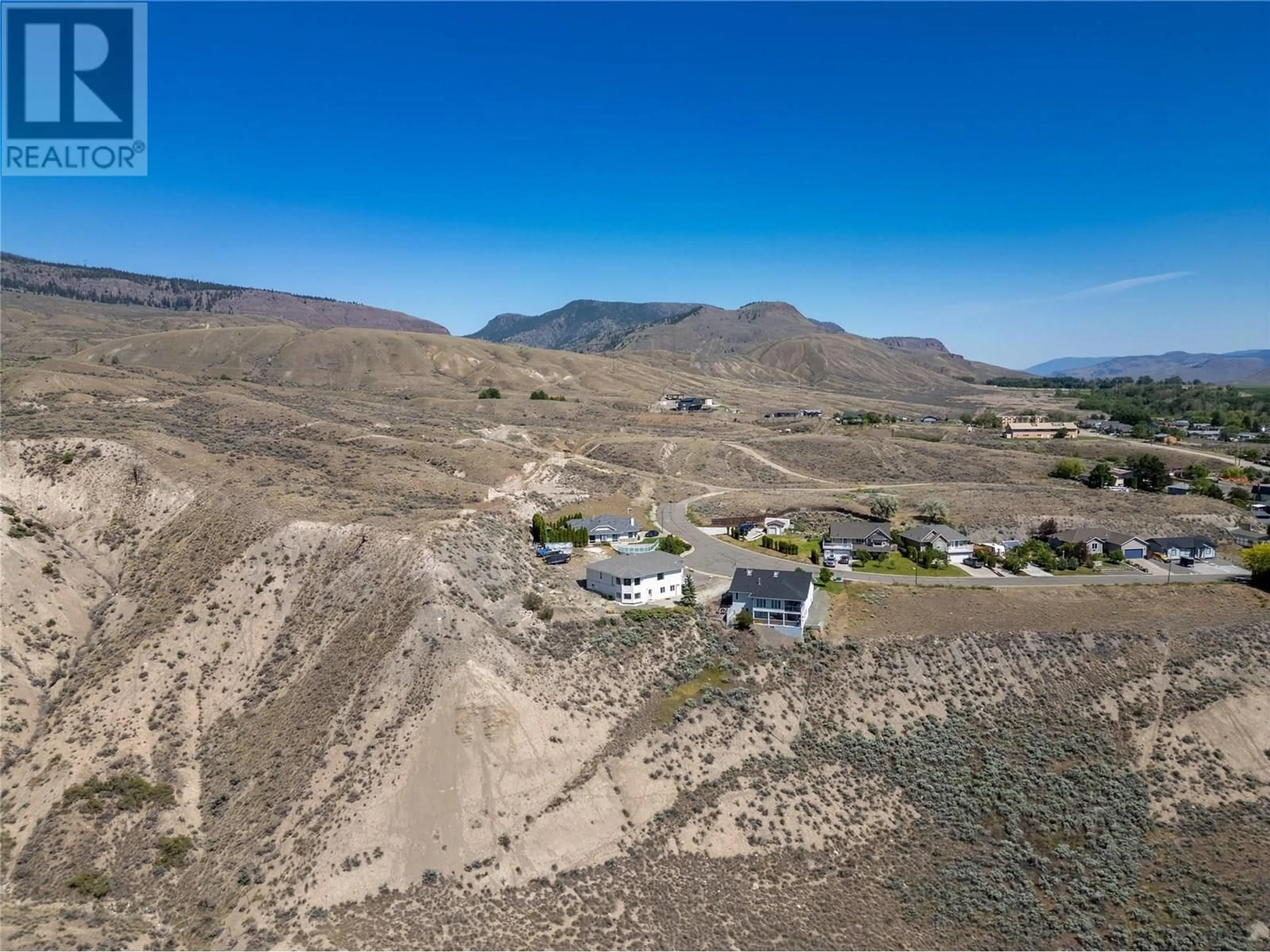 A pic from outside/outdoor area/front of a property/back of a property/a pic from drone, mountain view for 1396 SEMLIN DRIVE, Cache Creek British Columbia V0K1H0