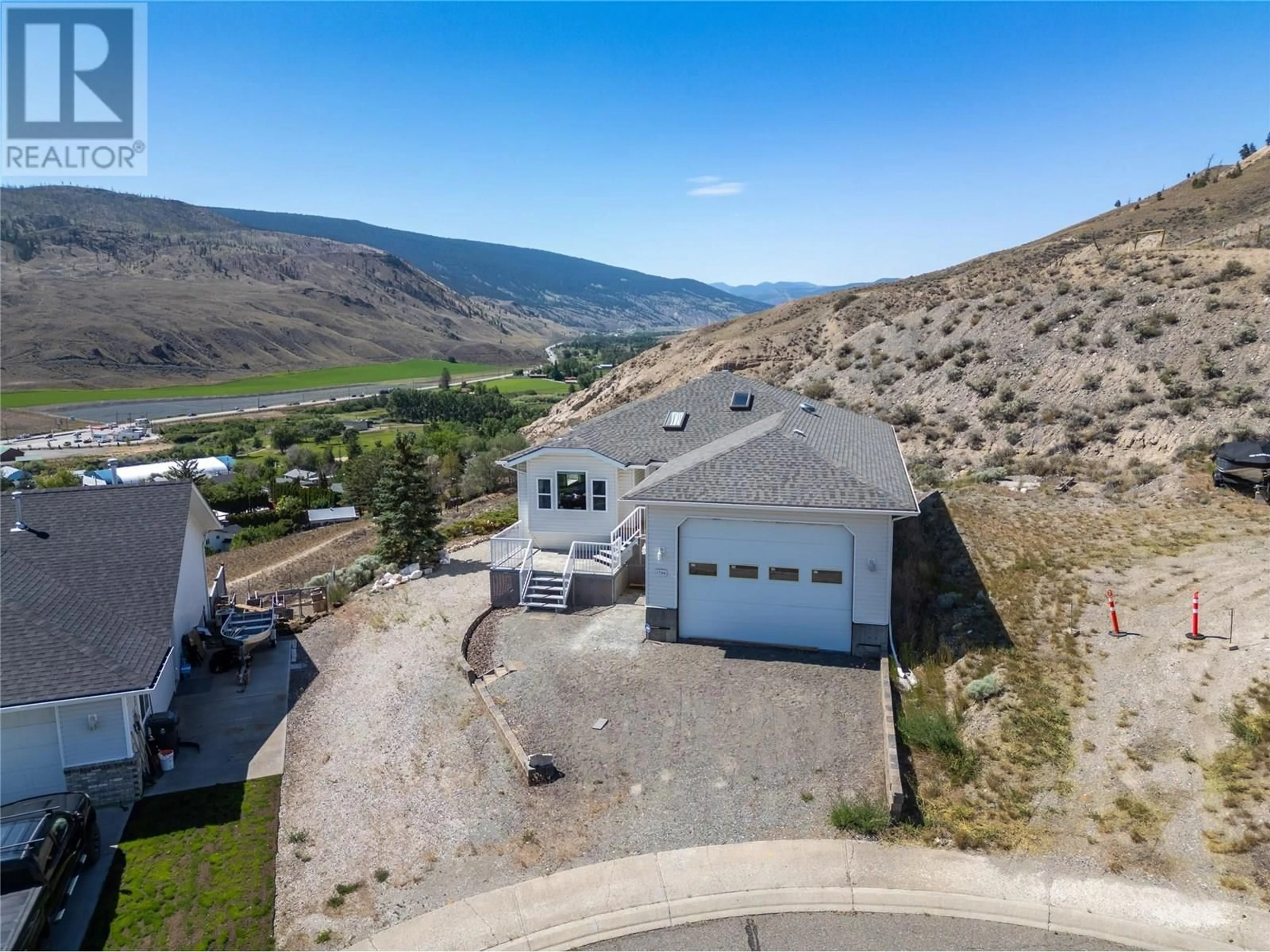 A pic from outside/outdoor area/front of a property/back of a property/a pic from drone, mountain view for 1396 SEMLIN DRIVE, Cache Creek British Columbia V0K1H0