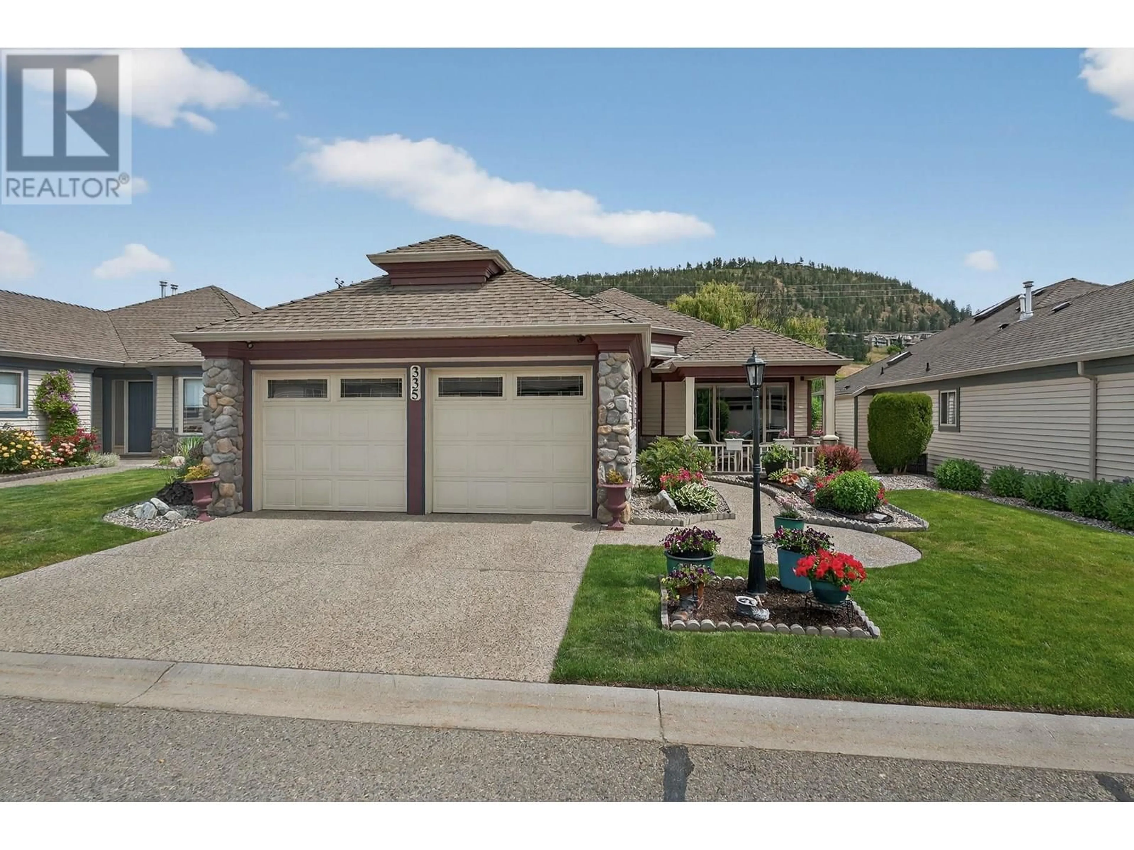 Home with vinyl exterior material, street for 335 - 550 YATES ROAD, Kelowna British Columbia V1V1Z4