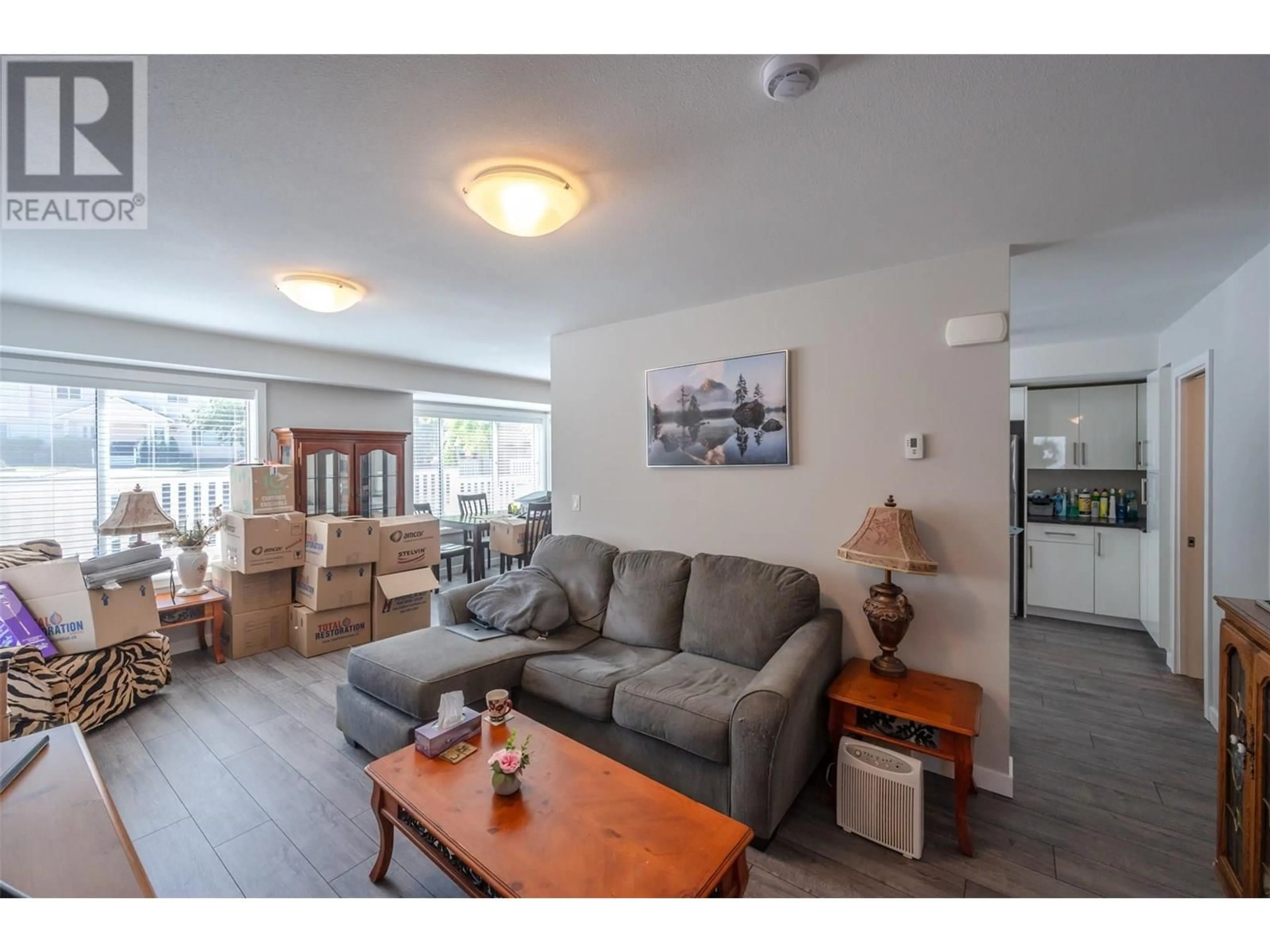 Living room with furniture, wood/laminate floor for 123 - 1458 PENTICTON AVENUE, Penticton British Columbia V2A8L3