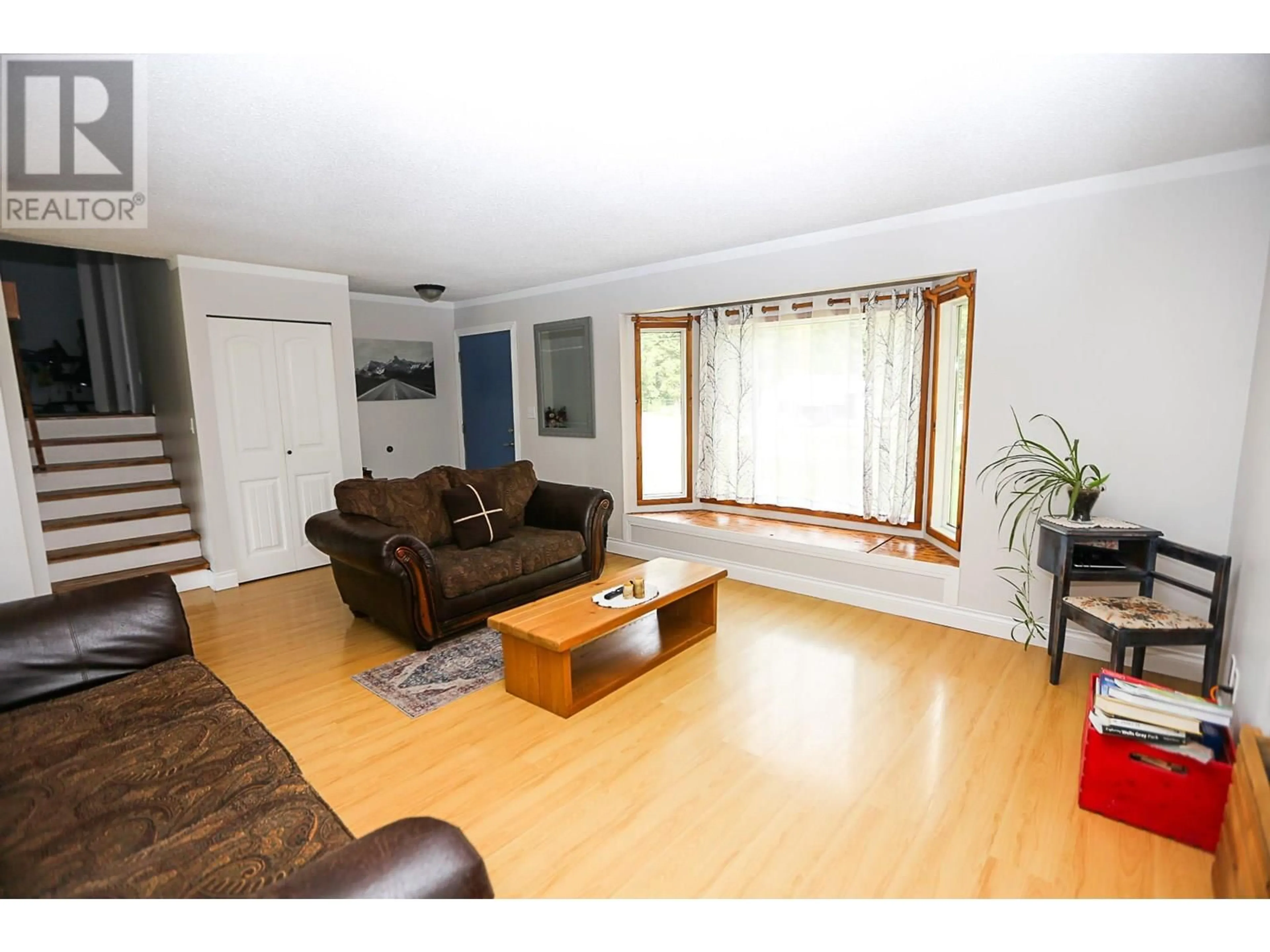 Living room with furniture, wood/laminate floor for 1133 CAROLINE ROAD, Clearwater British Columbia V0E1N0