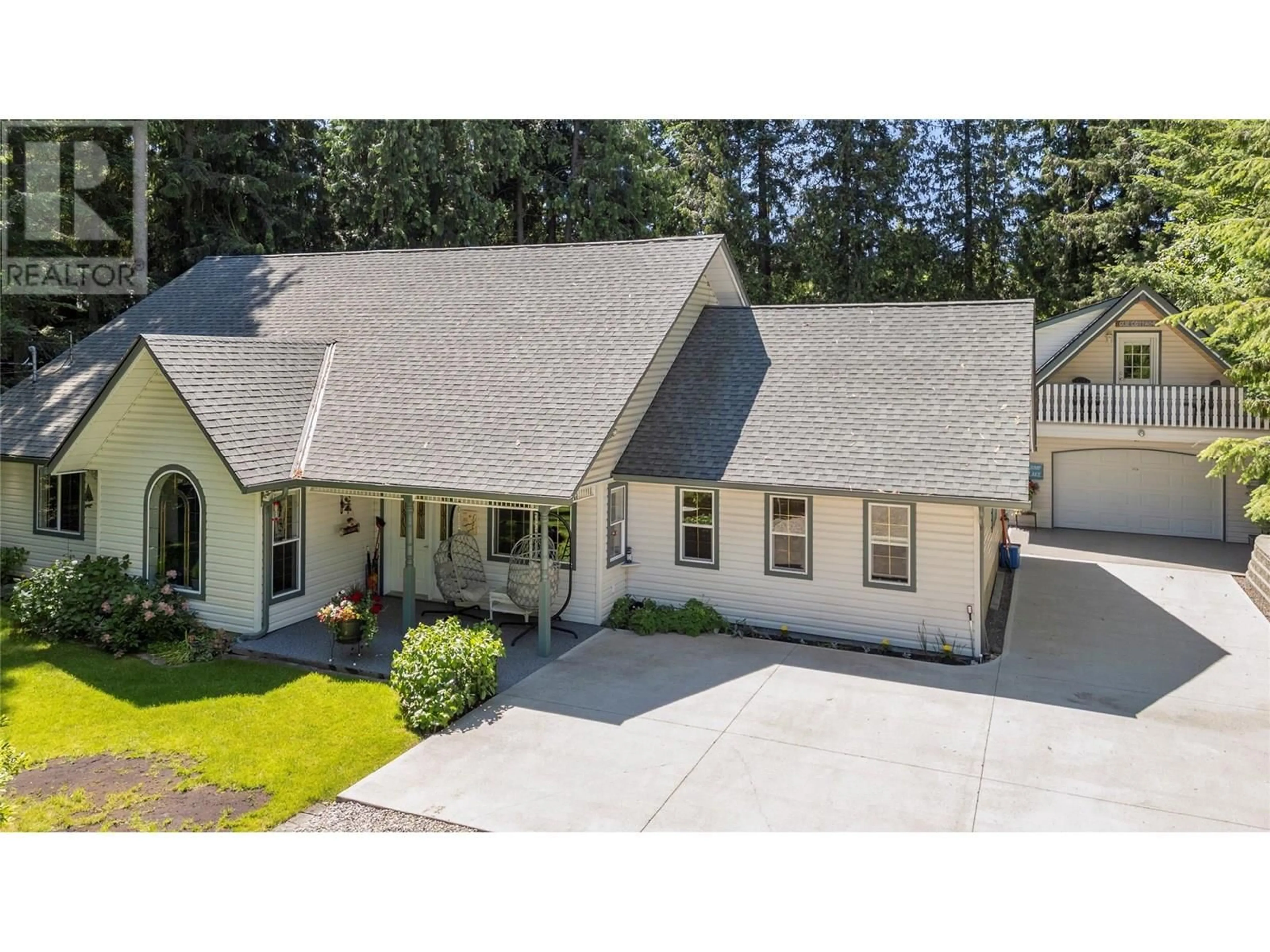 A pic from outside/outdoor area/front of a property/back of a property/a pic from drone, street for 1047 SCOTCH CREEK WHARF ROAD, Scotch Creek British Columbia V0E1M5