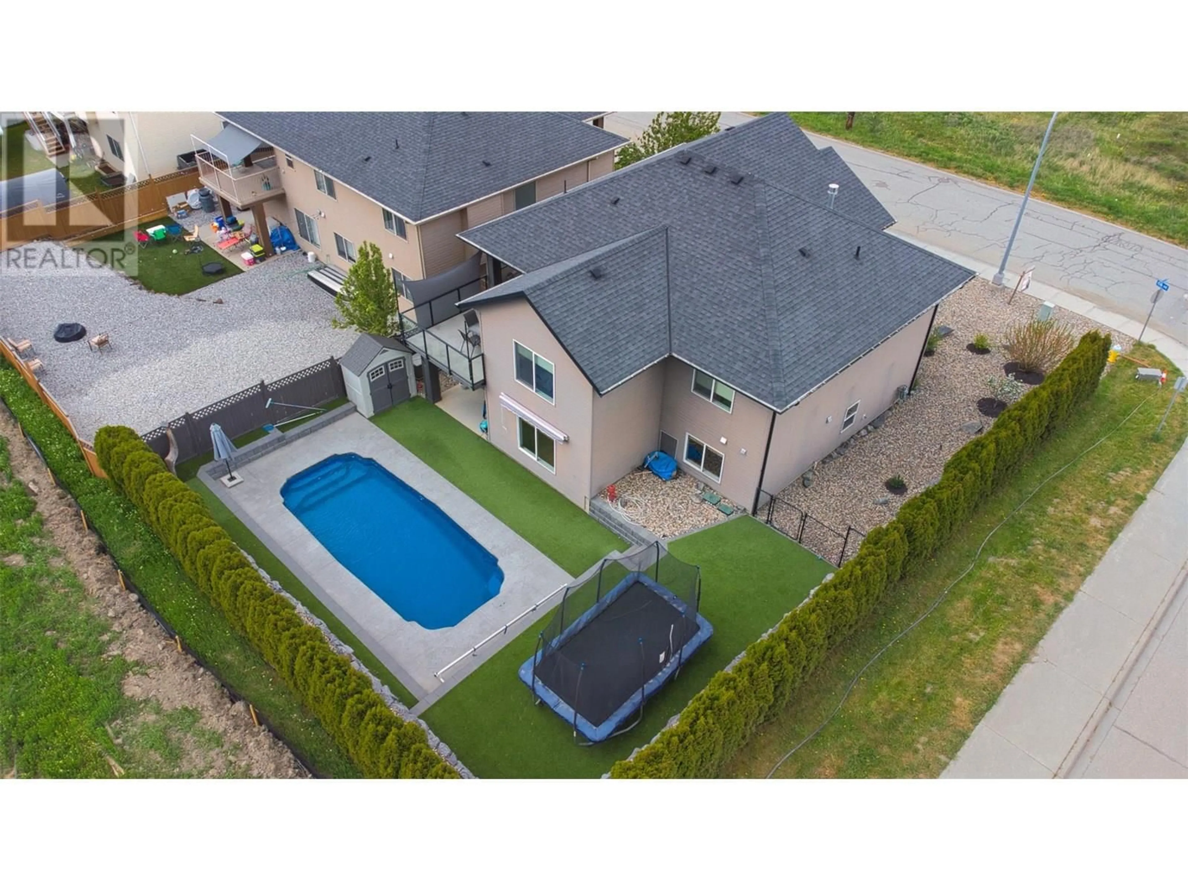 A pic from outside/outdoor area/front of a property/back of a property/a pic from drone, street for 1501 15TH AVENUE, Vernon British Columbia V1T9R4