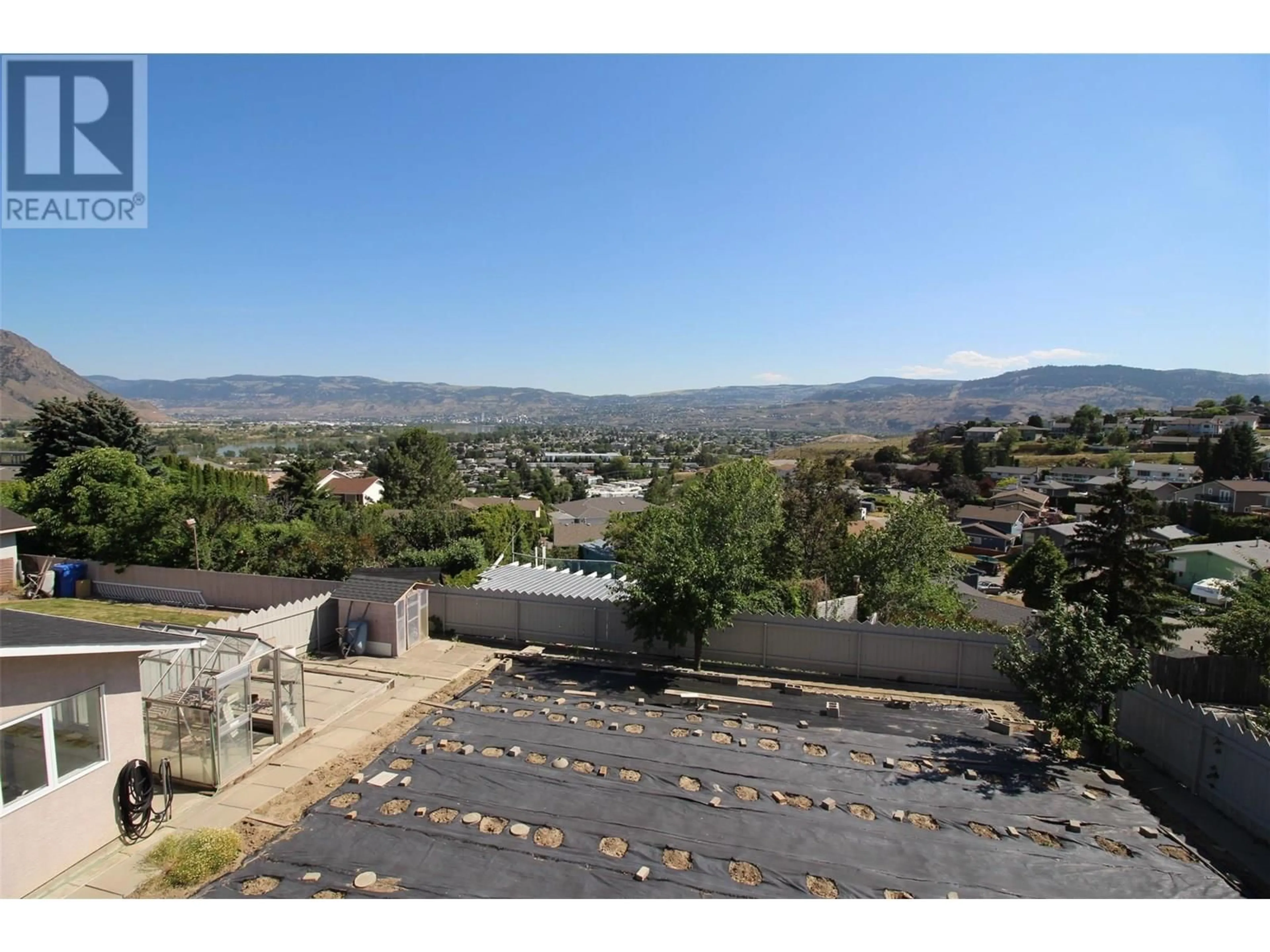 A pic from outside/outdoor area/front of a property/back of a property/a pic from drone, mountain view for 1727 BEARCROFT COURT, Kamloops British Columbia V2B8M2