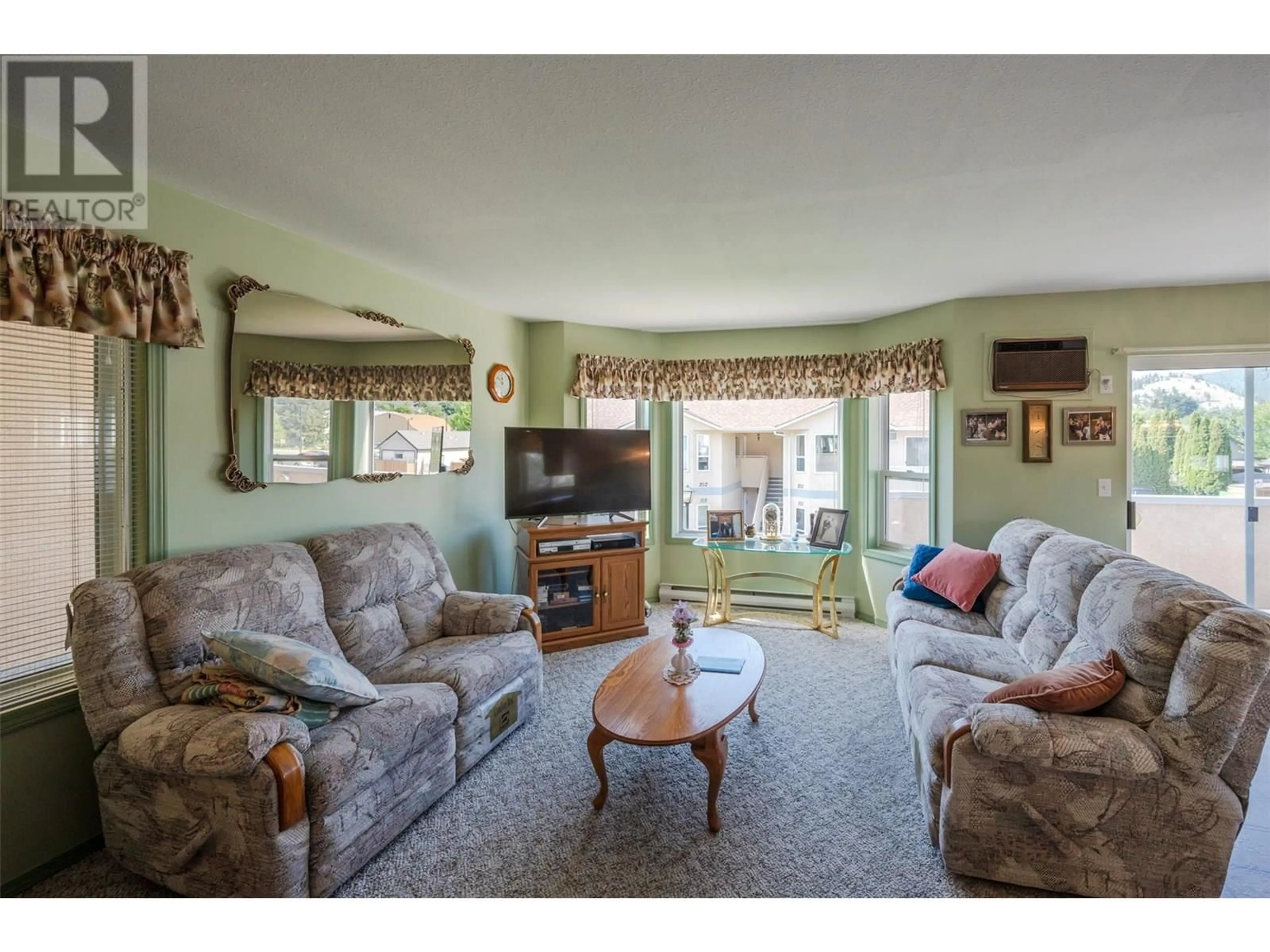 Living room with furniture, unknown for 205 - 13014 ARMSTRONG AVENUE, Summerland British Columbia V0H1Z0