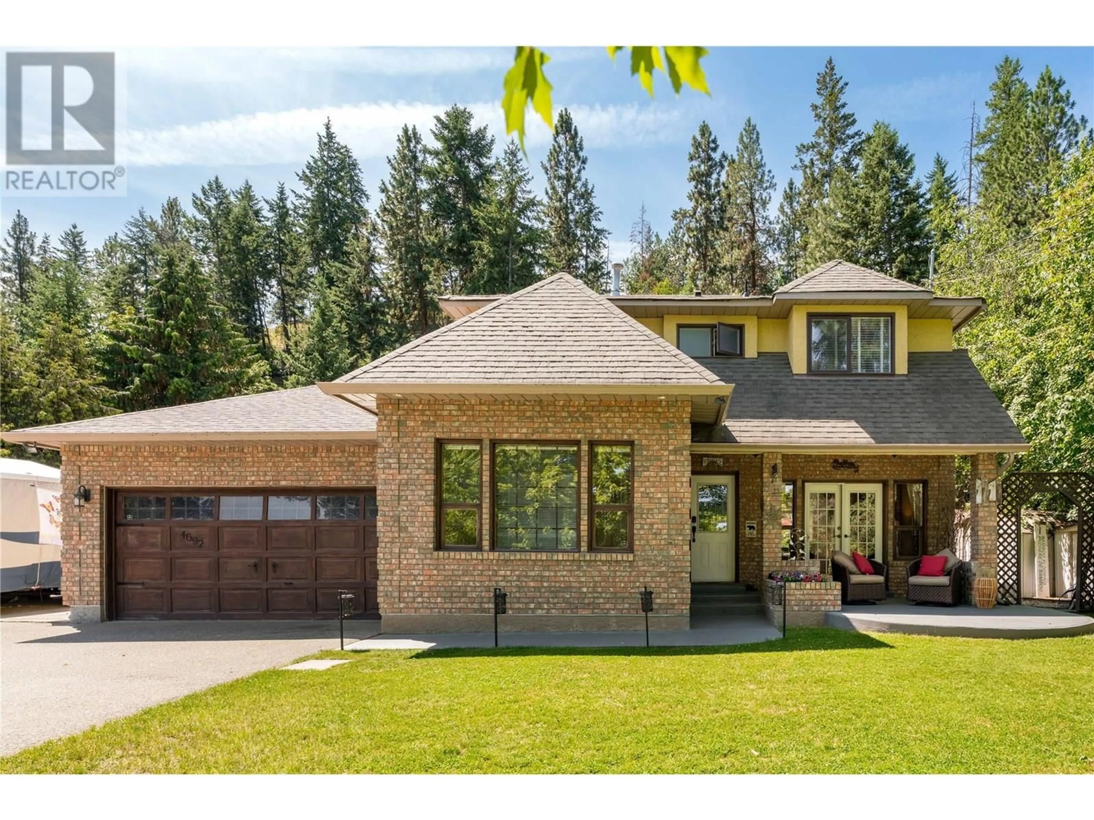 Home with brick exterior material, mountain view for 4692 GORDON DRIVE, Kelowna British Columbia V1W4P4