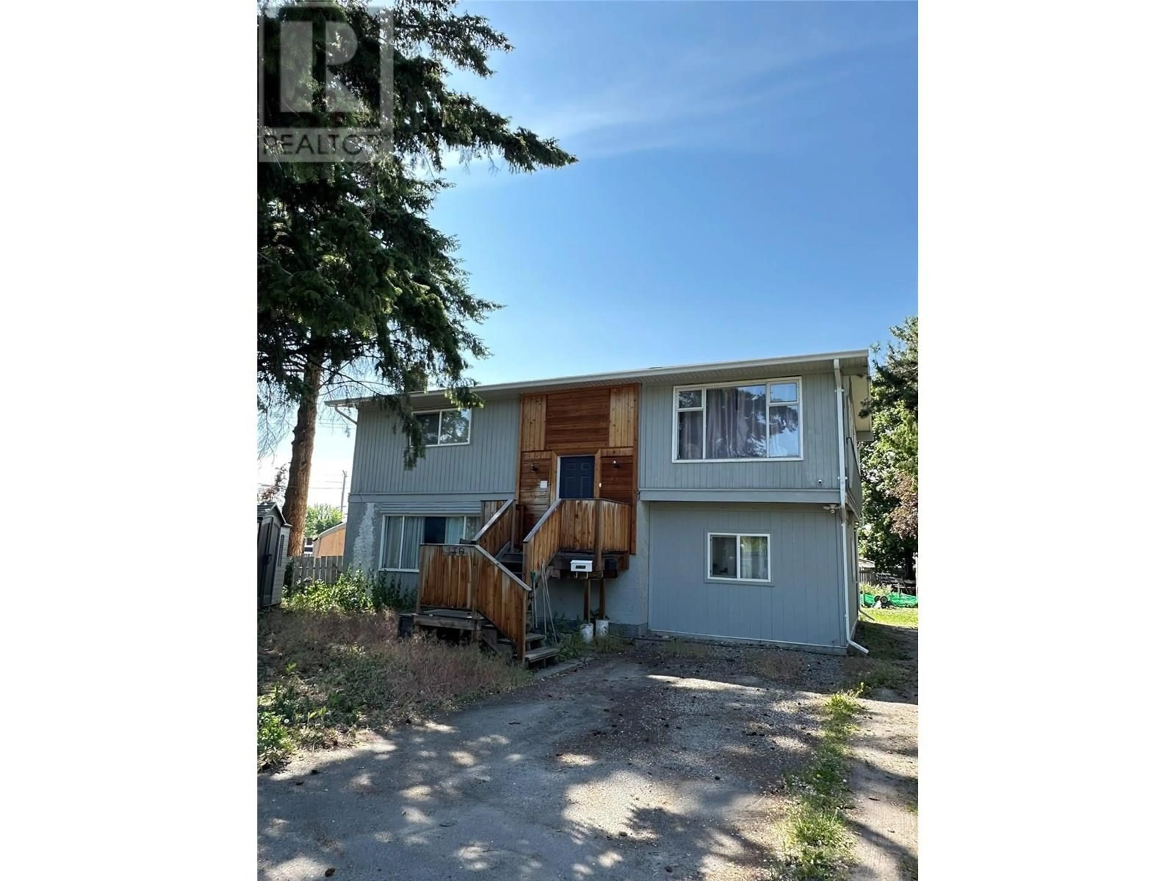Home with vinyl exterior material, street for 130 DYSART ROAD, Kelowna British Columbia V1X3R1