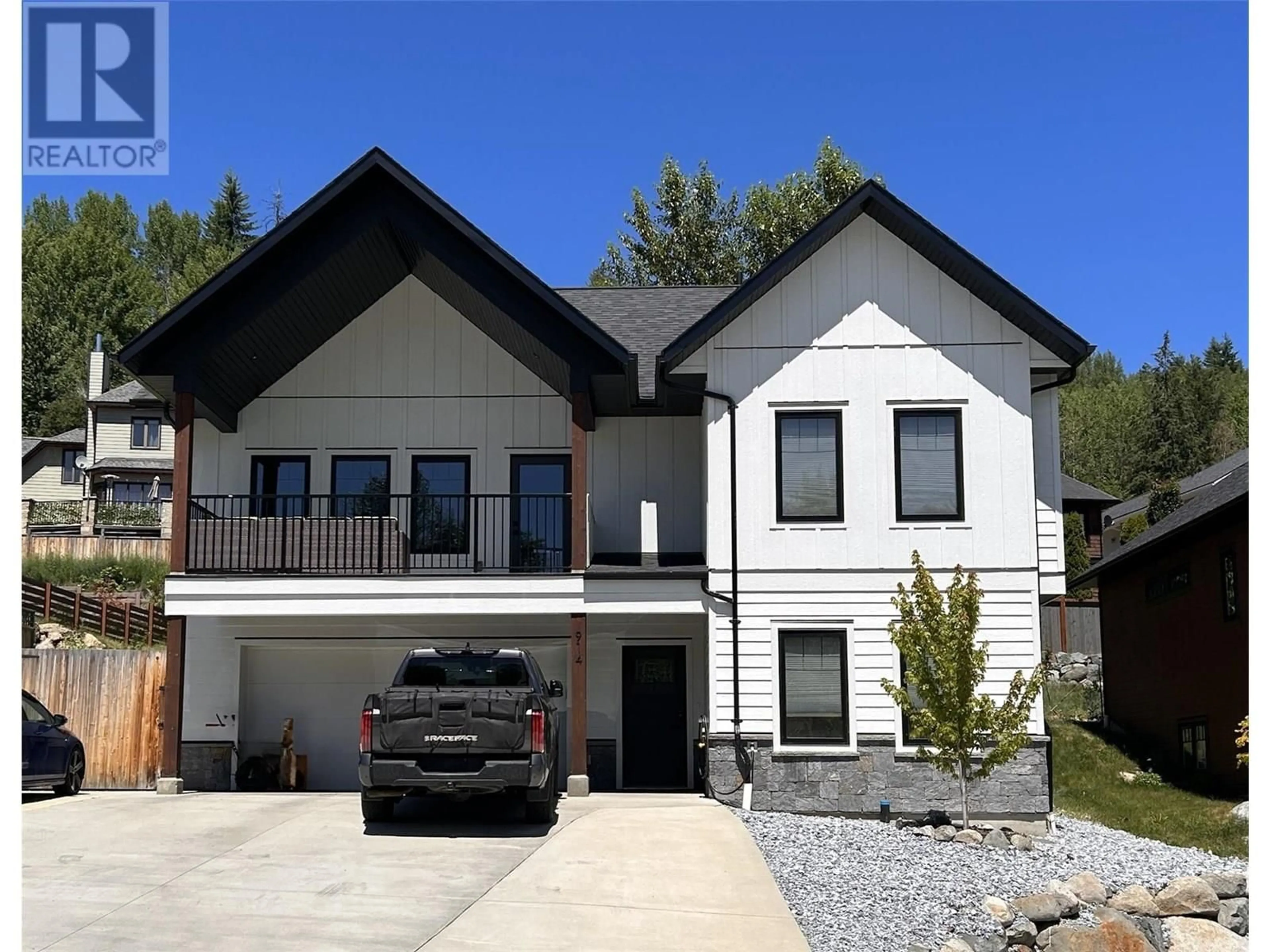 Home with vinyl exterior material, street for 914 REDSTONE DRIVE, Rossland British Columbia V0G1Y0
