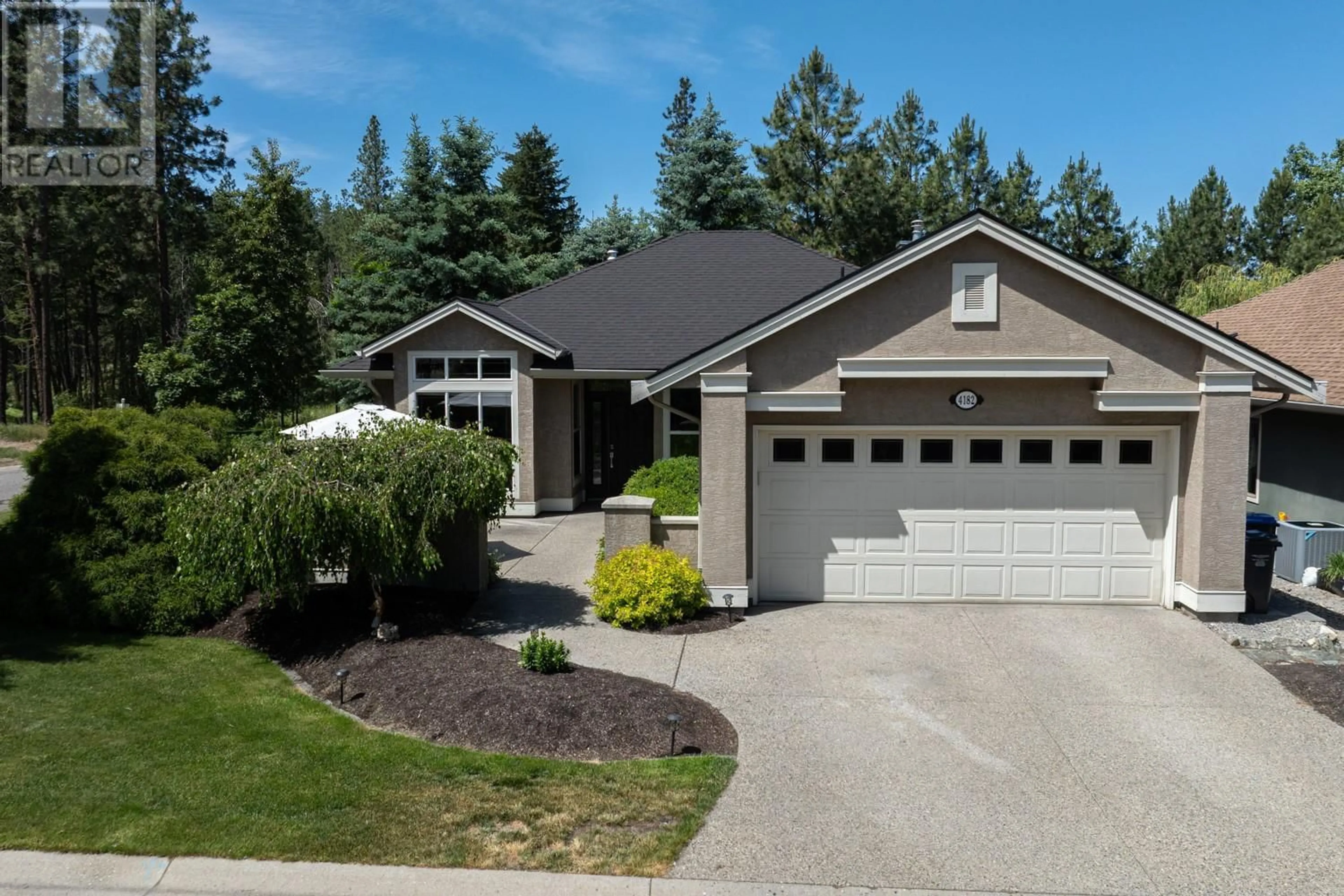 Home with vinyl exterior material, street for 4182 GALLAGHERS BOULEVARD SOUTH, Kelowna British Columbia V1V4X2