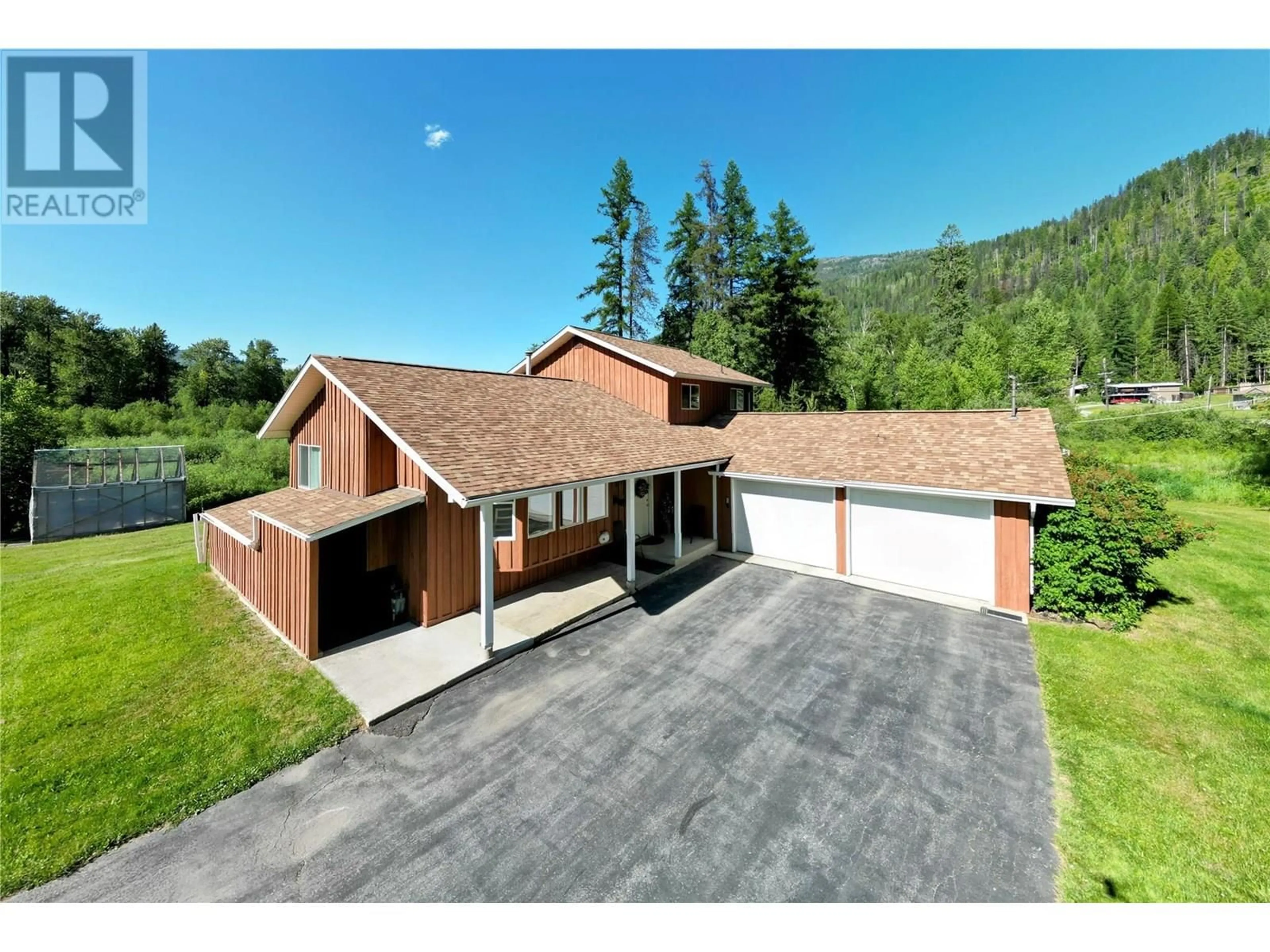 A pic from outside/outdoor area/front of a property/back of a property/a pic from drone, mountain view for 2235 HIGHWAY 3B OTHER, Fruitvale British Columbia V0G1L0
