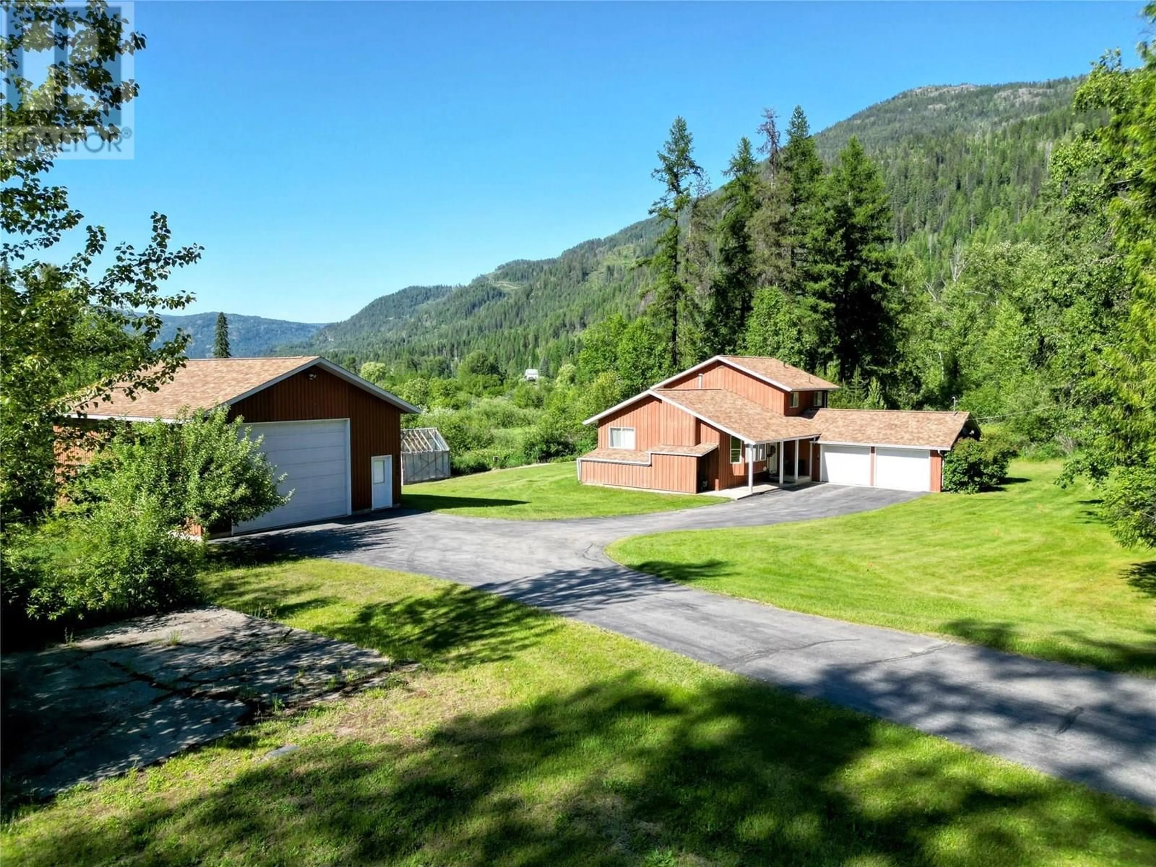 A pic from outside/outdoor area/front of a property/back of a property/a pic from drone, mountain view for 2235 HIGHWAY 3B OTHER, Fruitvale British Columbia V0G1L0
