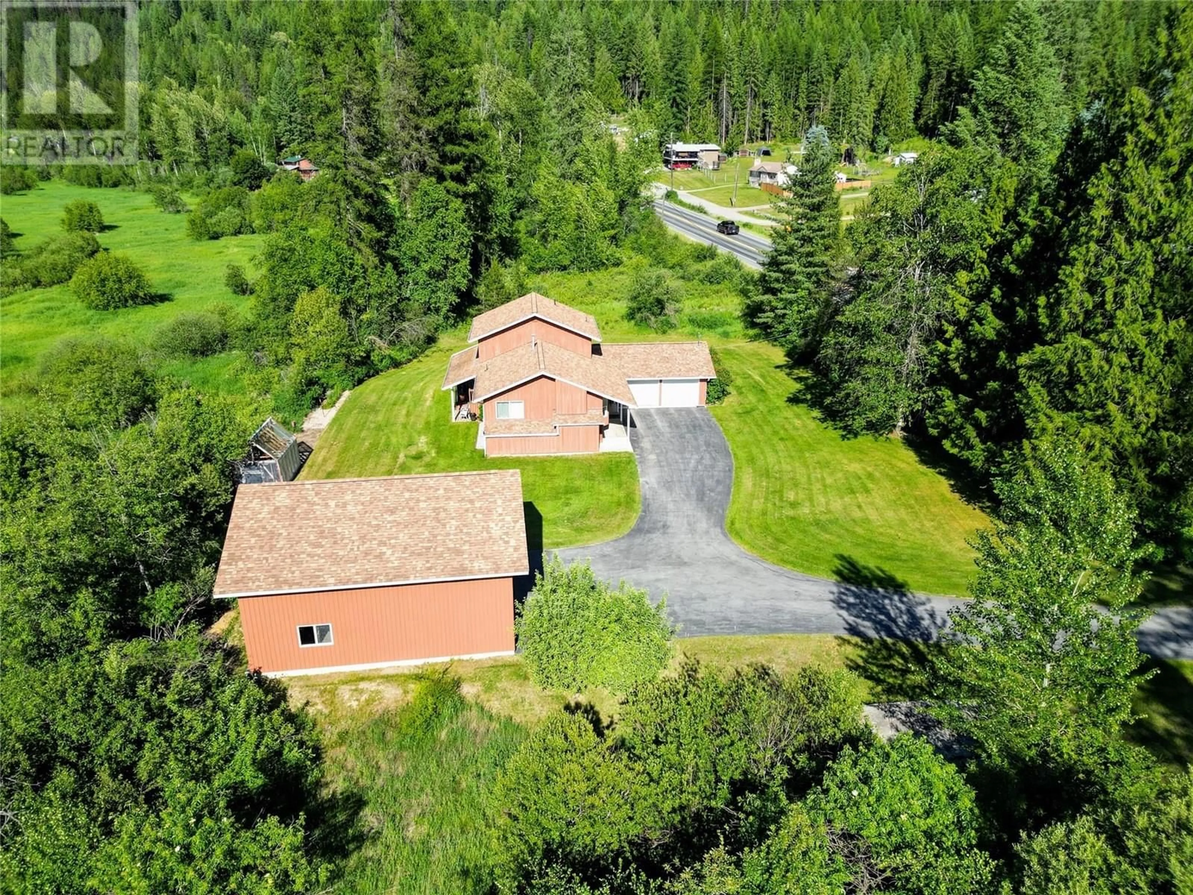 A pic from outside/outdoor area/front of a property/back of a property/a pic from drone, unknown for 2235 HIGHWAY 3B OTHER, Fruitvale British Columbia V0G1L0